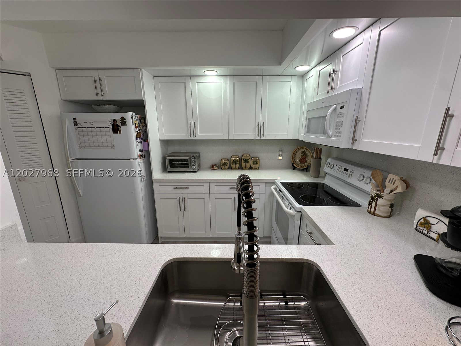 Looking for easy 55+ living in Pembroke Pines? This Gorgeous condo is completely remodeled top to bottom and features an updated kitchen, bathrooms, and floors, recessed lighting throughout; an in-unit washer and dryer; 1,045 square feet, and recessed lighting throughout. Sit on your patio overlooking the golf course and watch the sun set. Community offers transportation to nearby shopping, pharmacy, hospital/medical building, Clubhouse, Movie Theater, Billiard Rooms, Clinic, Convenience Store, Shuffleboard, Tennis, Gym, Multiple Pools, a host of arts and craft classes, clubs, and so much more in this amazing 55+ community. Transportation to surrounding medical and retail locations. No Pets
