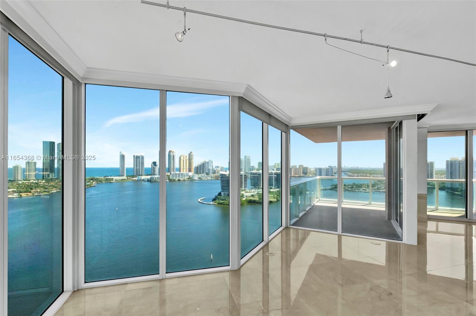 Wow! Enter This Redone 2130 sf Residence (3 Bed / 3.5 Bath all ensuites) + Den via Semi Private Elevator & See Best Direct Ocean, Intracoastal, Golf Course/ Lake Views. Sunrise And Sunset! No Expense Spared, Nothing Original Remains! Comes with 3 PARKING SPACES on the 3rd floor right next to the lobby door and Coveted Large Storage Unit! Over $300K Spent In Complete Remodel! A Must See! 5 Star Amenities include: 2 Story Health Club with Gym and Spa, 2 Pools, 3 Tennis Courts, 2 Pickle Ball courts, Private Marina, Valet, Security, & much more.