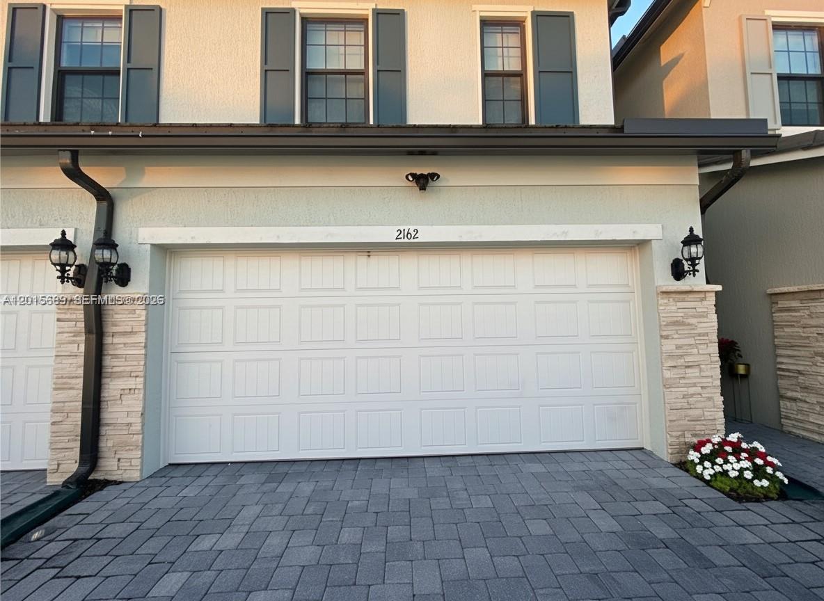 Experience luxury living in this stunning 2022-built lakefront townhome located in the highly sought-after gated community of Oak Tree. This spacious 3-bedroom, 2.5-bath residence combines modern design, smart home technology, and energy-efficient upgrades including SOLAR PANELS, whole-house WATER FILTRATION SYSTEM, EV charger connection, HURRICANE IMPACT windows and doors, Nest thermostat, and Ring security system. The bright open-concept layout features high ceilings, abundant natural light, elegant flooring, and a beautifully designed chef-style kitchen with quartz countertops, stainless steel appliances, oversized island, and ample cabinetry perfect for entertaining and everyday living. Upstairs, the spacious primary suite offers serene lake views, walk-in closets, and a luxurious spa-inspired bathroom with dual vanities and glass-enclosed shower. Additional bedrooms are generously sized with excellent storage and functionality. Enjoy relaxing water views from your private patio and the convenience of a two-car garage. HOA includes high-speed internet and access to Oak Tree’s resort-style amenities including clubhouse, state-of-the-art fitness center, pickleball courts, pool with cabanas, BBQ area, dog park, fire pit lounge, and more. Prime location just minutes from major highways, shopping, dining, Fort Lauderdale Airport, and South Florida beaches. SCHEDULE your private tour!!