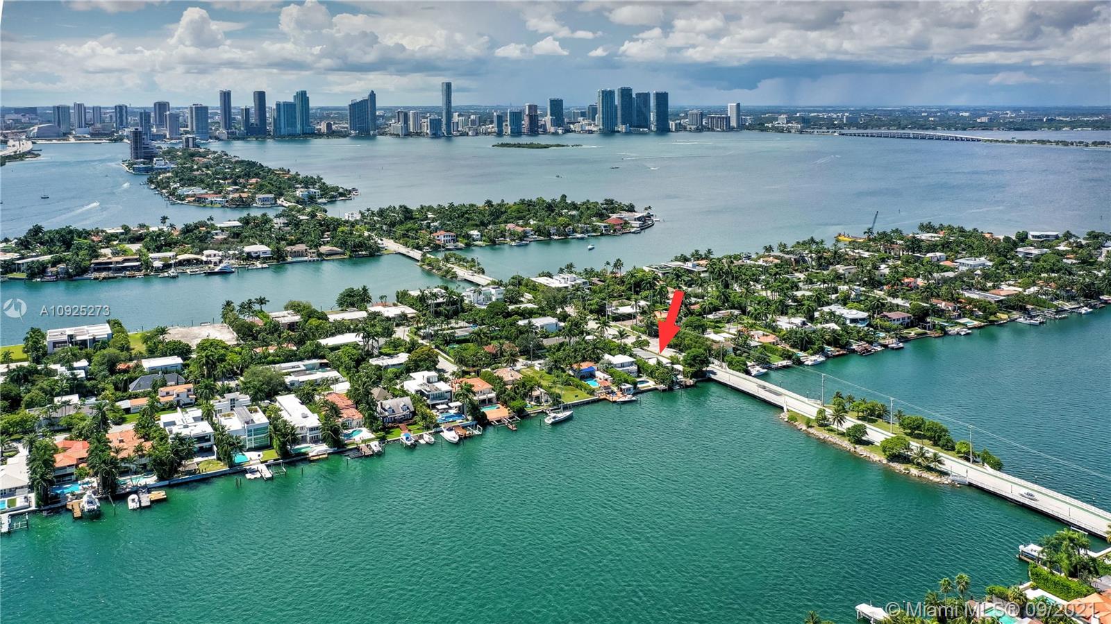 Exquisite DiLido Island waterfront mid-century modern designed for casually elegant entertaining. Lush tropical landscaping with an inviting peaceful entrance. Entering the home, you are met with wide open living & dining spaces perfect for a Miami lifestyle. Exquisite finishes include Marcel Wanders, B&B Italia & Flos lighting. The chef’s kitchen by ArcLinea blends beautiful stone, wood & lacquer along with Miele appliances. The master offers views of the water with an impressive wetroom & ample storage. The outdoor living space greets you with calm bay waters and an infinity pool. Maintenance–free landscaping allows for an oasis of secret spaces including a fire pit lounge & outdoor kitchen, bar & dining area outfitted with appliances from Hestan & True and a natural gas Pizza Oven.
