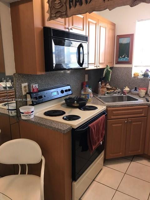Great opportunity for investors in sought out location. Unit centrally located close to parks, malls and beach. The refrigerator was recently renewed and unit  was recently painted. Very secure building with covered assigned parking. Beautiful swimming pool and low maintenance.