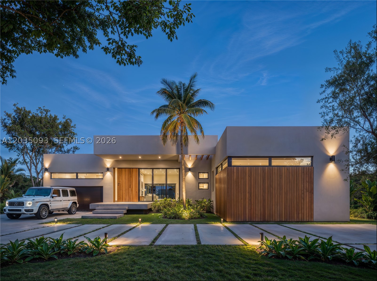 **3,972sq ft under AC/ 4,498sq ft total.** Construction complete July 2026 - be settled in before the school year.  Custom-built North Pinecrest estate on a lush 15,000 SF lot on a quiet street, one block from Royal Palm Tennis Club and zoned for top-rated Pinecrest Elementary and Palmetto schools, with Gulliver and Palmer Trinity minutes away. An oversized Italian pivot door opens to a dramatic great room with 13-ft ceilings and a 28-ft multi-track sliding glass wall framing the resort-style pool, spa, summer kitchen, cabana bath, and dry sauna. The chef's kitchen features bespoke Italian cabinetry installed by master millworkers from Italy, a full Sub-Zero & Wolf appliance suite, and whole-house natural gas. The private primary wing offers an oversized custom closet plus two additional flexible rooms ideal for an office, media room, fitness studio, or dressing room. Five bedrooms, 6.5 baths, timeless stone and custom millwork throughout. Oversized garage with high ceilings, lift-ready for up to four-car capacity. Brand-new 2026 construction with complete impact glass and doors for significant insurance savings, delivered with builder warranty. Fifteen minutes to MIA, Coral Gables, and Baptist Health. A rare opportunity to own truly custom new construction in Pinecrest's most coveted pocket.