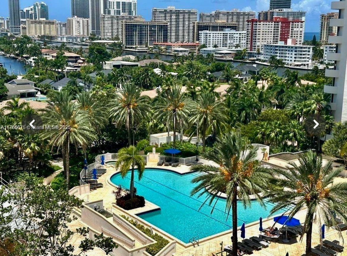 Enjoy the breathtaking views of the Intercoastal Waterways, Ocean, Pool and Cty landscapes from the comfort of this spacious 2 bedroom 2 bath unit with abundace of natural light pouring throught the panoramic windows creating a bright and airy atmostphere perfect for relaxing, family gatherings or entertaining. Modern open plan living area, large bedrooms and closets. Kitchen w granite counter. The large balcony add extra space to relax and sip your morning coffee or just unwind in the warm evenings. The community offers outdoor cafe, spa and fitness center, 3 pools, 4 lighted tennis courts, beauty parlor, BBQ,  playground for children,library and party room. Price reflects building renovations until late summer. Contact listing agent to schedule your viewing today.