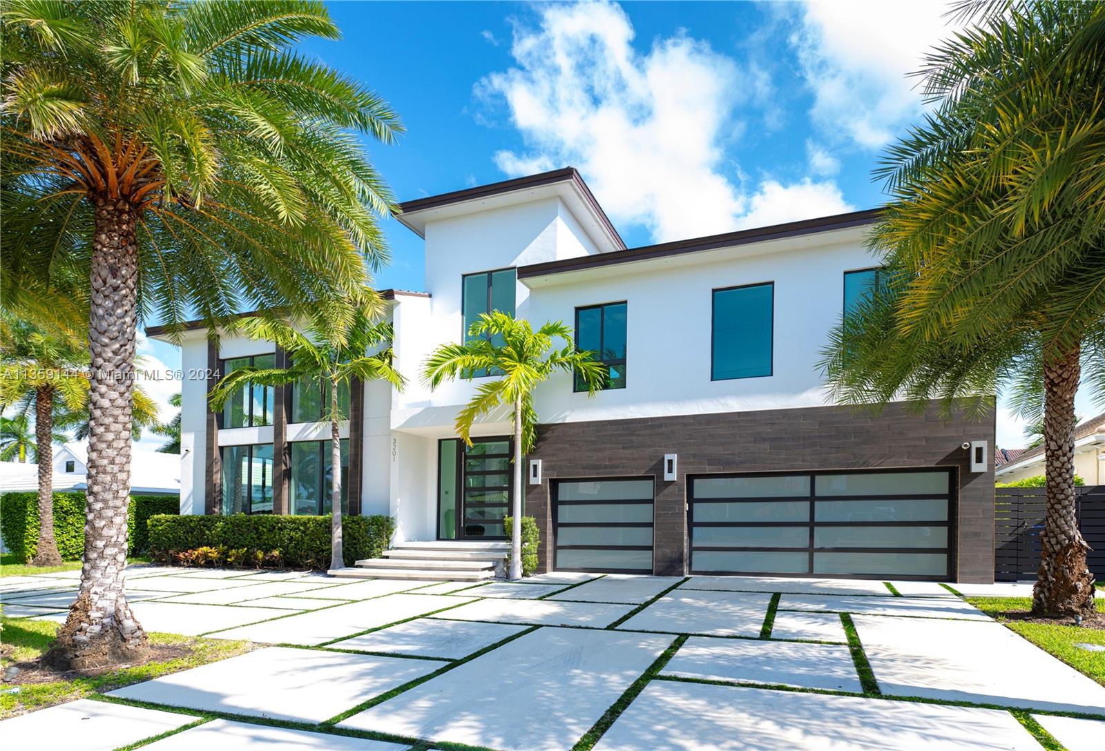 New luxury home on The Landings features timeless architectural designs, impeccable details & high-end amenities with exceptional quality construction. This two-story stunning residence offers 6,080 total sqft & 3 car garage. The floor plan includes 5 Bed, 5.2 baths, Cabana w/closet, Library, Office. Amazing view to the canal will be enjoyed from most of the areas including the Master Bedroom on the second floor accessed by a glass stair case or elevator. This gem boasts PGT hurricane impact windows & doors, Pivot entry door, marble/wood floors & recirculating hot water. Integrated smart features including cameras, lights, sound system & alarm can be handled from phone or wall displays. Water front 85" of water front. Also lighted Onix constructed bar w/climate-control wine cellar