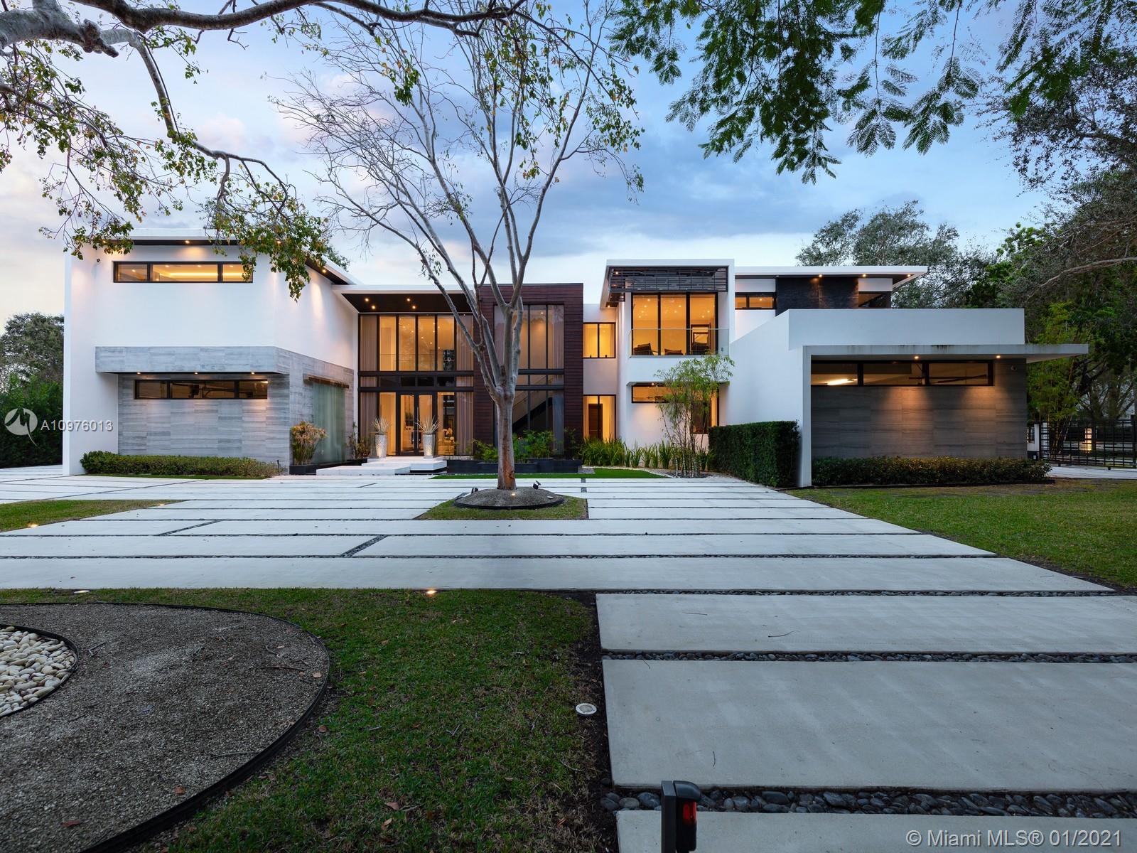 Located in the prestigious, sought-after neighborhood of N. Pinecrest this NEW modern estate is a unique compound comprised of 3 structures: main house, guest house & separate gym & media/play room situated on a 1.1 Acre walled & gated corner lot. Ingenious architectural masterpiece by renowned architect Eduardo Calil was designed as a tropical oasis w/ extensive use of glass throughout, Ipe accents including pool deck, features Zen waterfall, reflecting pools, and Mega Chess. White Carrara marble flrs provide a clean modern look throughout the house. Ideal family home boasting 7 BRS in the main house, w/ separate master wing, 100 bottle glass wine cellar, elevator, outdoor “Living Room”, cabana bath, mature landscaping & outdoor showers.