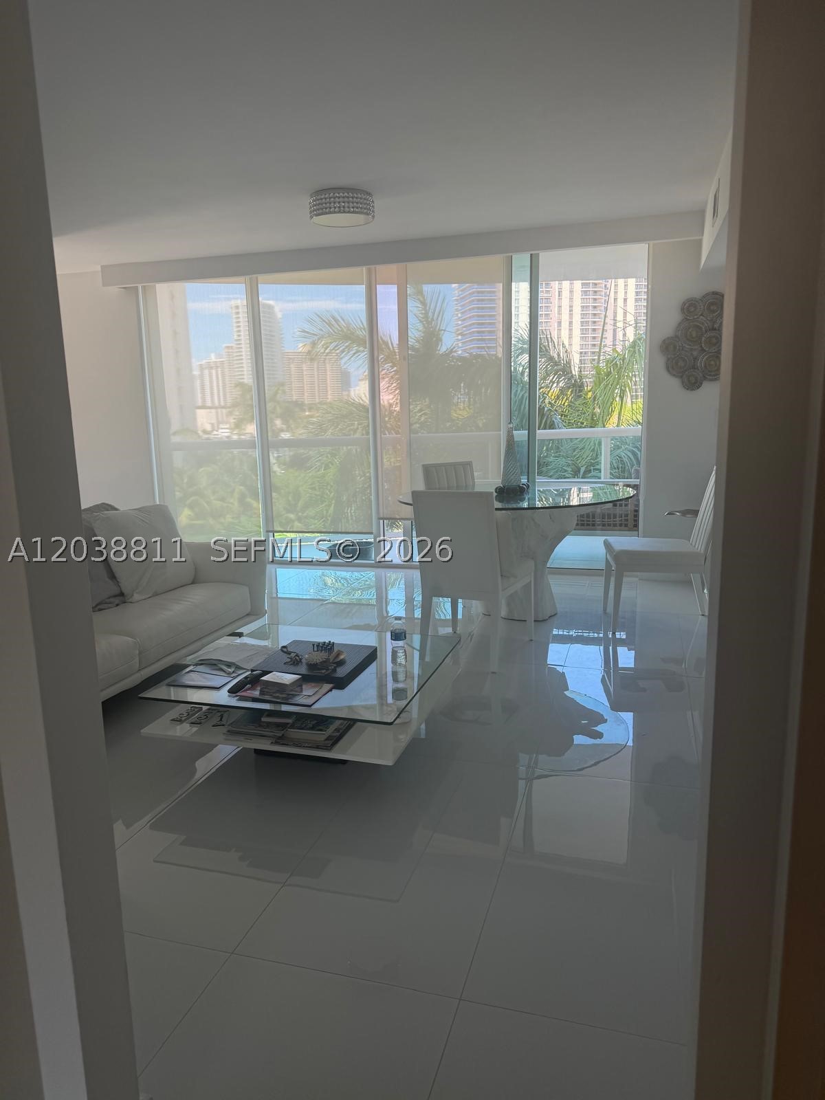 Exceptional opportunity to lease this fully furnished 2-bedroom, 2-bath residence with an additional half bath in the heart of Aventura. Comfortably accommodates up to 7 guests with 2 queen beds, a sofa, and an inflatable mattress (den not included for tenant use). Ideally located near Aventura Mall, Turnberry Isle Country Club, beaches, shopping, dining, and major highways. Enjoy resort-style amenities including a swimming pool, fitness center, sauna, 24-hour security, and valet service. Available for a 3-month seasonal rental from July through September 2026—a perfect opportunity to enjoy the South Florida lifestyle during the summer, including the exciting World Cup season. Association approval required.