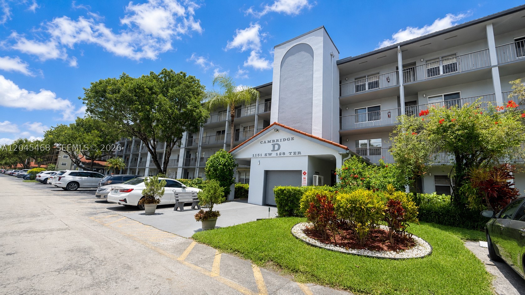 Enjoy a peaceful water view from the screened balcony of this second-floor 2-bedroom, 2-bath condo in Century Village. The home offers a practical layout with an eat-in kitchen, separate living and dining areas, generous storage, and an in-unit washer and dryer. Bring your ideas and update the interior to match your own style. The elevator is conveniently located near the residence, and the community pool is directly across from the building. Century Village is an active 55+ community offering golf, tennis, pools, fitness centers, a clubhouse, theater, restaurant, courtesy transportation, and gated security. A great opportunity to create your own South Florida retreat. Investors Welcome!