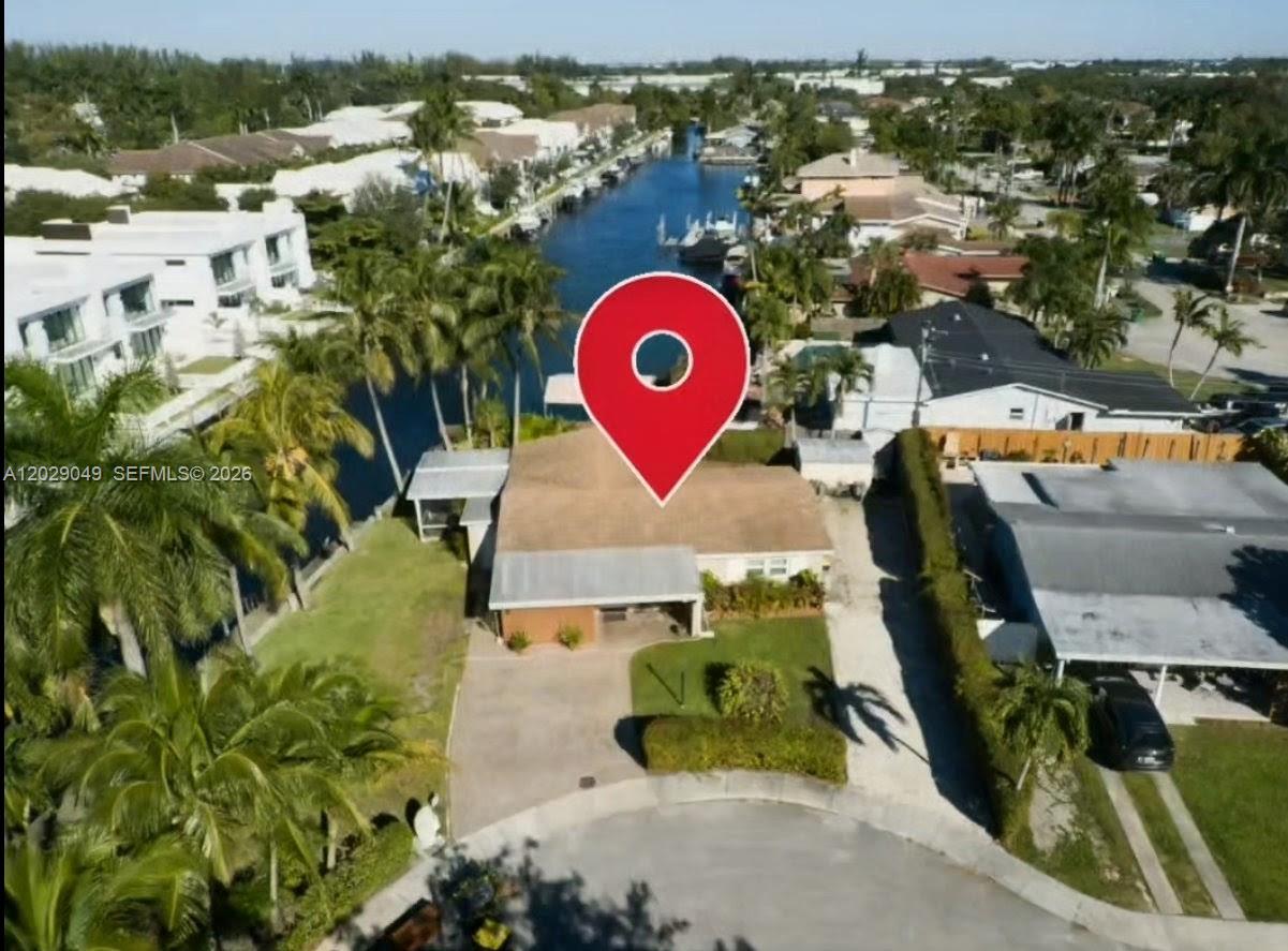 Experience the ultimate South Florida waterfront lifestyle in this meticulously maintained single-family home
located on a quiet residential street. This boater’s dream property features a rare 120-foot seawall and a private
wood dock with deep-water canal access to the Atlantic Ocean, plus a nearby public boat ramp for added
convenience. Designed for comfortable living and entertaining, the home offers a spacious 3-bedroom, 2-bath split
floor plan with an open-concept kitchen, formal living room, and a bright family room that flows seamlessly
through dual sliding doors to the outdoor living area. Enjoy year-round coastal living from the screened waterfront
porch or the open patio perfect for relaxing, hosting guests, and taking in the water views. The residence is move in ready and upgraded with hurricane-impact windows and doors, providing enhanced safety and peace of mind.
With no HOA and generous parking space for a boat, RV, or trailer, this property offers exceptional flexibility and
freedom. Ideally located near major entertainment, dining, shopping, and the airport, this waterfront gem
combines prime location, lifestyle, and functionality a rare opportunity for buyers seeking the best of South Florida living.