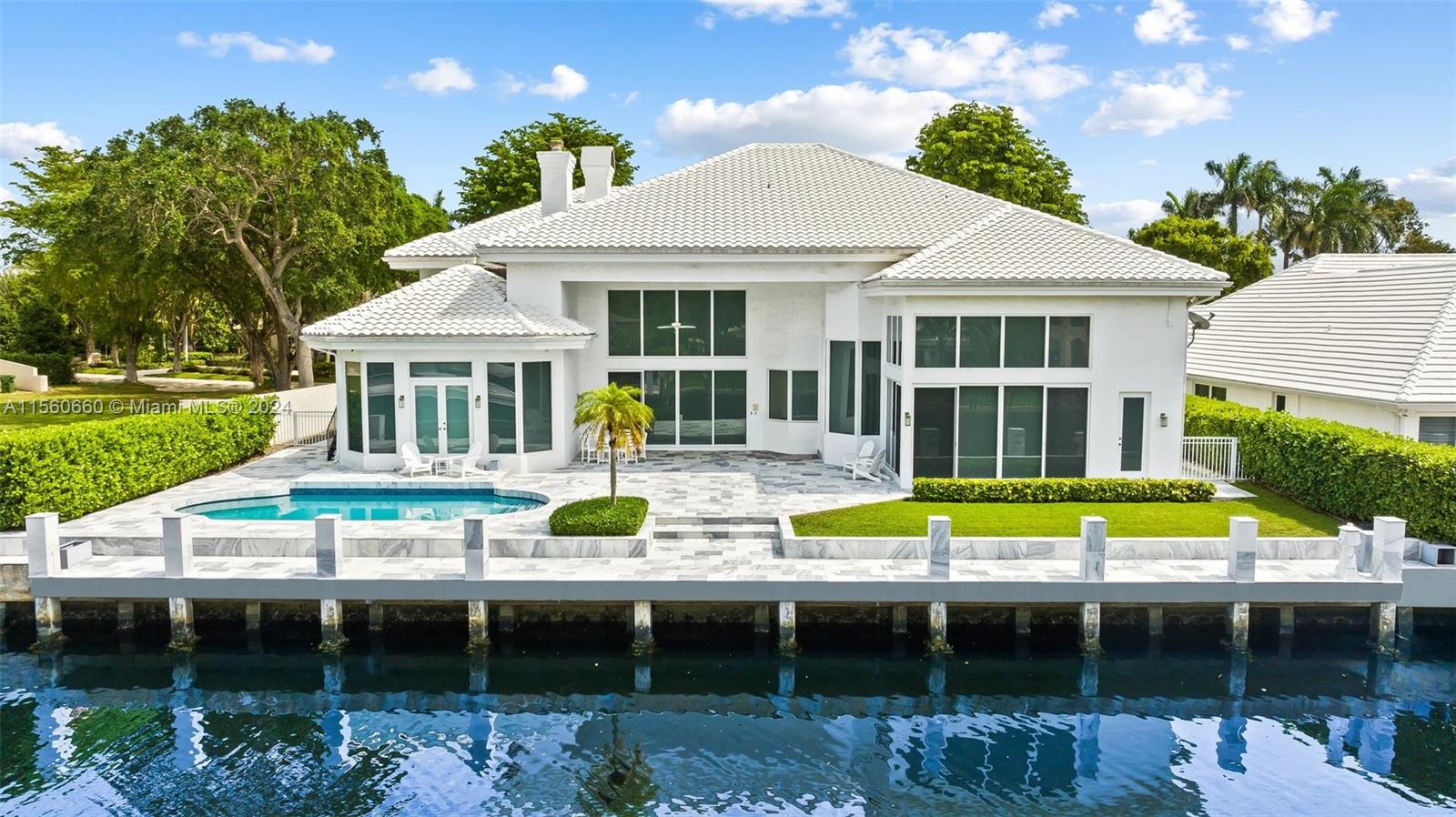 Luxury waterfront living awaits at 101 Bay Colony Dr. This expansive 7-bed, 8-bath estate spans 5,700+ sqft and has a 3-car garage. Several entertainment spaces from the newly renovated kitchen with granite countertops to the large lounge/family room. The home is fully equipped with impact glass, a generator, 5 central A/Cs, and ADT security with cameras. The sprawling backyard features 108ft on the water, a marble deck, a saltwater pool, and a raised concrete dock with both power and water. The home’s location provides you with proximity to top schools Pinecrest, Westminster, and Cardinal Gibbons as well as the executive airport. Come home to one of the most desirable secure gated communities in all of South Florida that is armed and guarded 24/7.