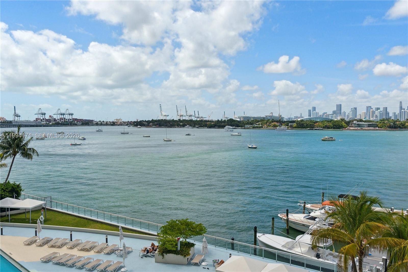 Experience the South Beach living in this direct bay-front studio at Mirador 1000. This condo features laminated wood all throughout, white kitchen cabinets and quartz countertops, and stainless-steel appliances, and an updated bathroom. With new floor-to-ceiling impact glass windows and all-glass balcony, the home offers breathtaking sunsets over Biscayne Bay. Full-service building. Residents of Mirador 1000 benefit from world-class amenities including a sprawling bay-front pool and deck, a state-of-the-art fitness center, a private market, and a luxury spa,  24-hour valet and security. Located in the heart of West Avenue corridor, this exceptional property is just steps from Whole Foods, Pura Vida, and premier local shopping.