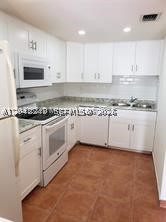 Condo unit, 1 bedroom and 1 and a half bathroom. Located in a second floor. Condo has two stories, entry first story with kitchen, spacious living and dining area, second story with a very spacious bedroom, closet, full bathroom, laundry room with full size washer & dryer. Located in a desirable area of Miami. Perfect for an investor who wants to have a passive income with a low monthly maintenance fee. Property rented. Very well maintenance. Please bring your client.