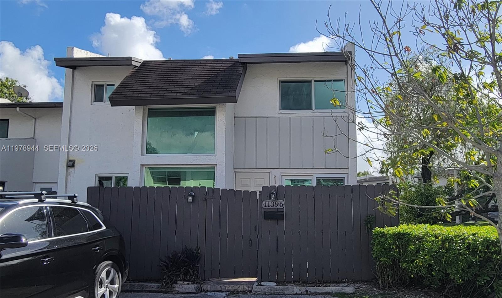 This charming corner-unit 3bd/2bth townhome features a beautifully updated kitchen (2022), newer appliances (2022), and a fully renovated upstairs bathroom and flooring. The popcorn ceilings have been removed for a clean, modern look. Enjoy peace of mind with hurricane impact windows and doors installed in 2022. A convenient bedroom and full bathroom are located on the first floor. The backyard is fully fenced in and perfect for relaxing or hosting outdoor gatherings.  The community offers resort-style amenities including a pool, tennis courts, playground, and 24-hour security. Seller to provide a $10,000 credit to buyer at closing with a reasonable offer.