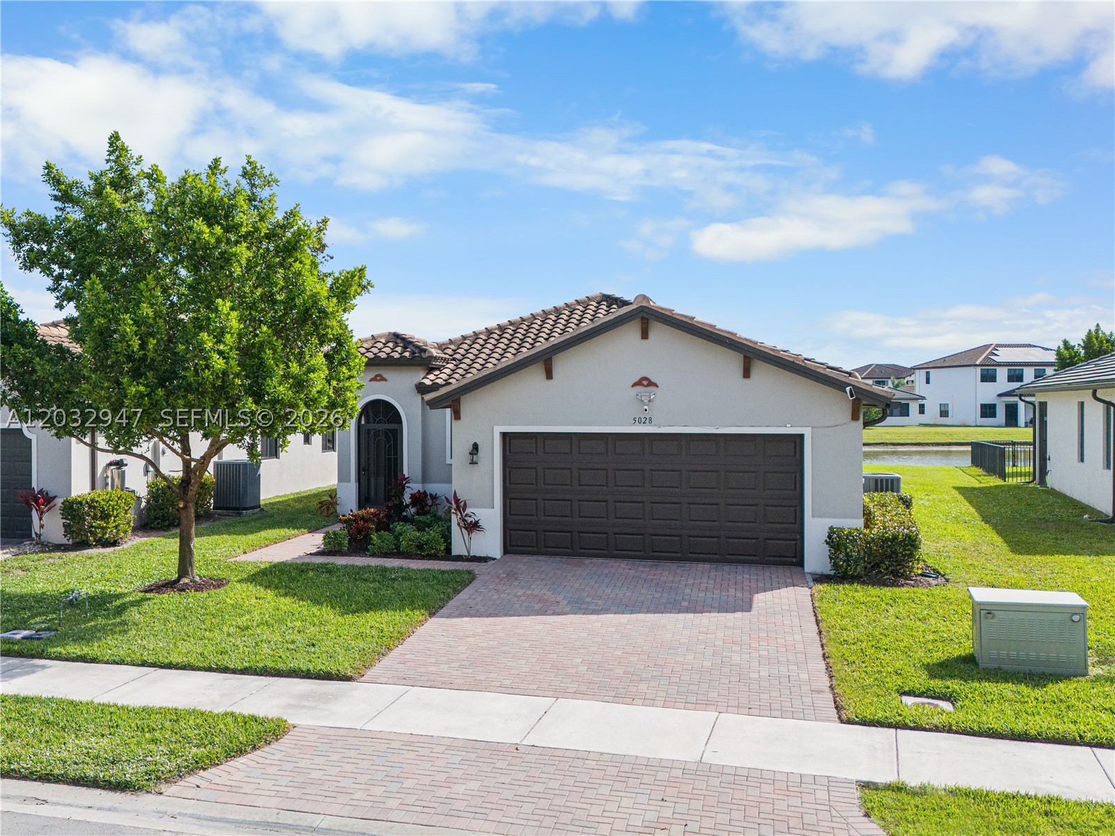 Gorgeous One-Story lakeview home located in the desirable Maple Ridge, Ave Maria Community. Spacious open floor plan flows into a modern kitchen equipped with stainless steel appliances. Natural light throughout the entire house with tasteful finishes. Step outside to enjoy the backyard, screened patio and a serene lake view, ideal for relaxing and entertaining. This community offers resort style amenities which include pool, playgrounds, fitness center, tennis and pickle ball courts. Very close to Ave Maria's Town Center. Easy to show.