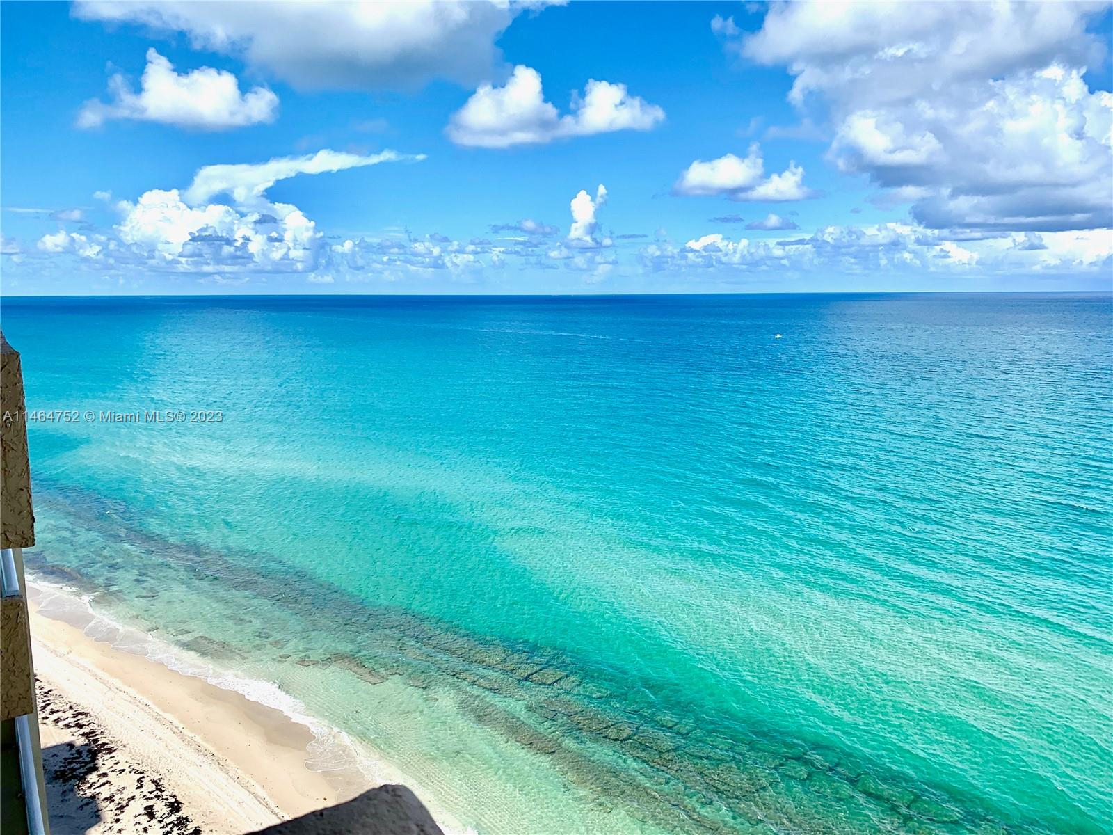 Updated penthouse corner unit located directly on the beach! Enjoy watching sunsets and the beautiful sunrises balcony wrapping around equipped with clear glass railings for open views. This balcony in this unit is larger than most of the balconies and extends the length of the unit. Interior includes stainless steel appliances, all custom wood cabinetry, large pantry, granite countertops, high end finishings, built-ins, tile flooring, custom blinds and bar. Master bedroom has a big walk-in closet with vanity and marble bathroom. The oversized second bedroom has a full wall of deep set closets. Waster and Dryer are inside the unit & COVERED PARKING! The unit also comes with extra storage on the floor and bike storage.