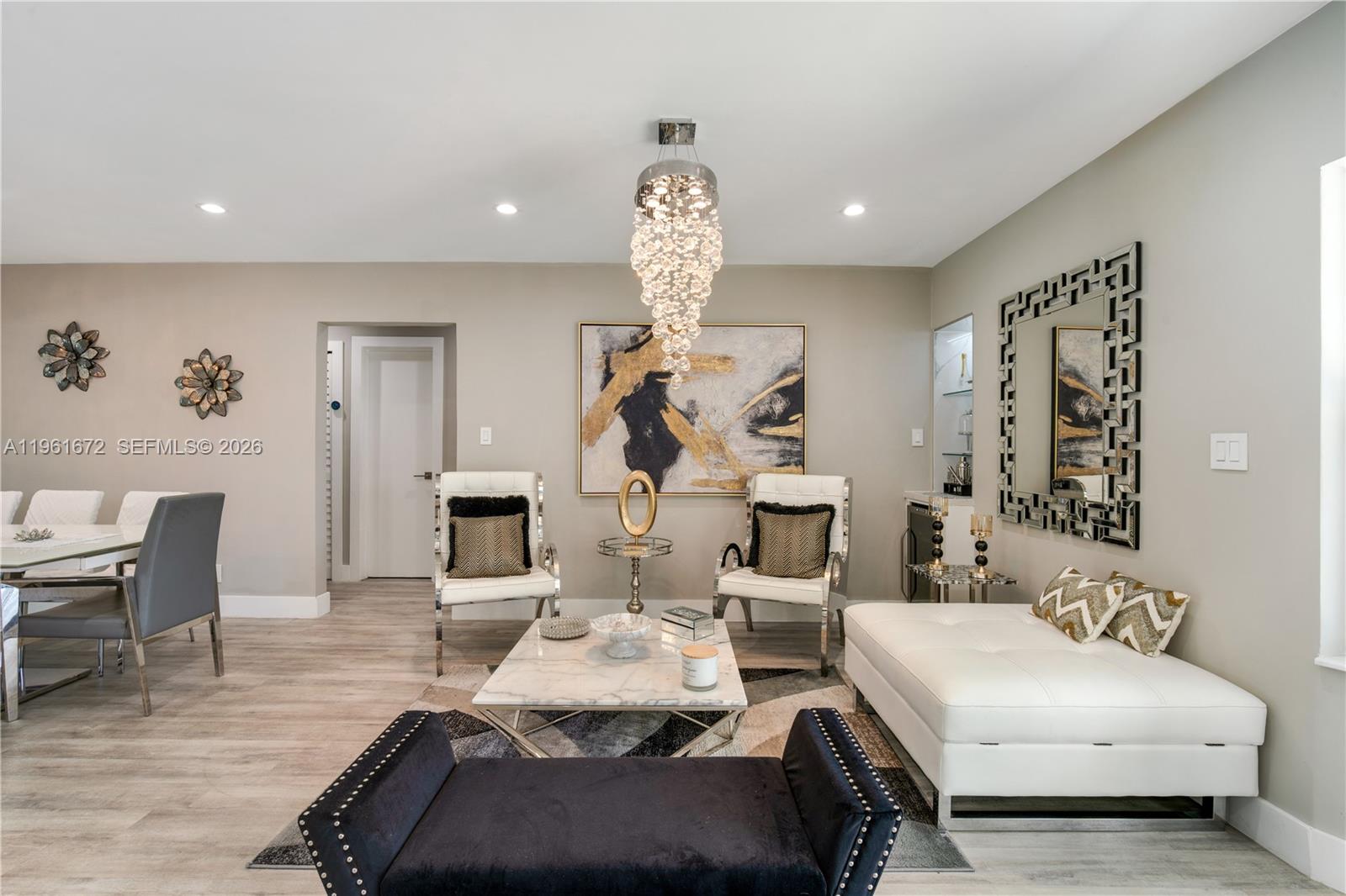 Back on the Market!!. Nestled within the prestigious enclave of Lighthouse Point, this meticulously remodeled residence offers refined elegance and effortless comfort. Featuring 3 bedrooms, 3 full bathrooms, and 1 half bath, the home is thoughtfully designed for both sophisticated living and entertaining. The open-concept layout is enhanced by abundant natural light, impact windows and doors throughout, and seamless indoor-outdoor flow. The chef’s kitchen is beautifully appointed with quartz countertops, top-of-the-line appliances, and custom finishes, serving as the heart of the home. Step outside to a private garden oasis featuring a sparkling pool and an inviting covered barbecue area, complete with a modern stainless-steel grill and comfortable outdoor seating—ideal for relaxed gatherings and elegant entertaining. Ideally located just minutes from pristine beaches, marinas, fine dining, and upscale shopping, this exceptional property presents a rare opportunity to enjoy the best of South Florida living in one of Lighthouse Point’s most desirable neighborhoods.The ceiling lamps in the living room, dining room and main bedroom are not included in the price.
