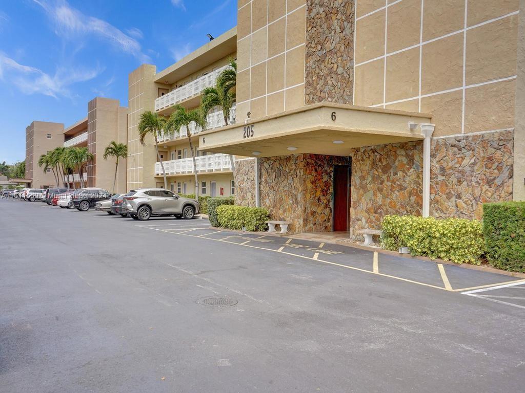Impeccable, completely remodeled with permits, corner unit lakefront condo. Washer Dryer in unit. Modern fixtures & lighting, beautiful white porcelain flooring. Washer/dryer in unit! Heated pool. Clubhouse has a full kitchen and BBQ area. Great for parties. 40 year inspection complete. Building has a new fire alarm system. New roof, elevator is 4-5 years old, parking area redone, 2 miles to beaches, close to shopping, dining, Jai-Lai, casinos, Hard Rock Hollywood, Hollywood Broadwalk, air & sea ports. Walk to grocery, banks, dining. Rules state one buyer must be 55 or older. Ample parking space for 2 cars. No lease for 2 years. $400/mo. maint. Quiet, well maintained community. Furniture is virtual. Professionally managed. One owner/occupant must be 55 or older/rules. No children allowed.