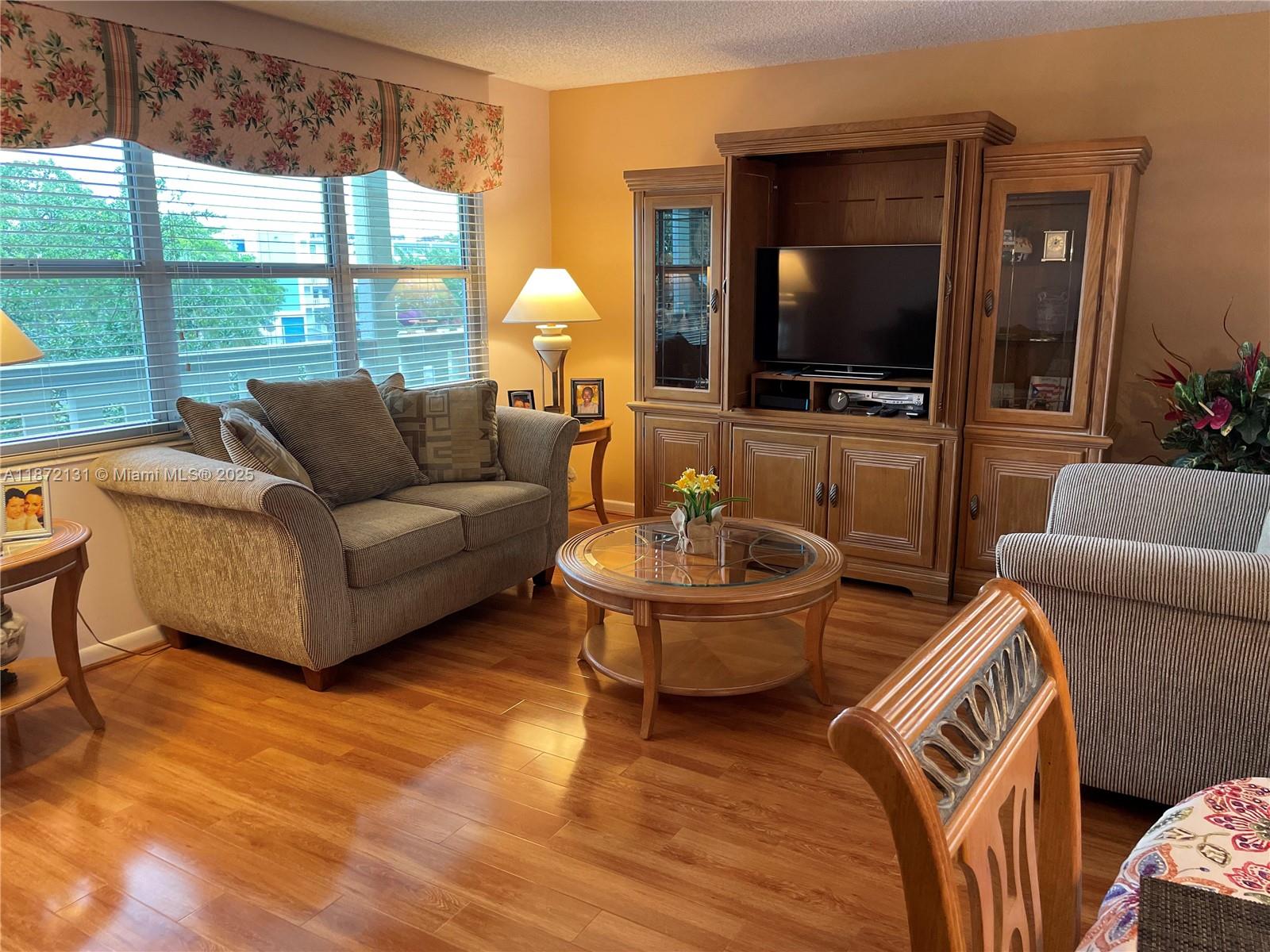 PRICE IMPROVEMENT SELLER READY TO MAKE A DEAL! BRING YOUR OFFERS! Opportunity is knocking. This is the one you've been waiting for—meticulously maintained, in a prime location, at an exceptional value. Welcome to 3033 Berkshire B, where comfort meets convenience in S.Florida’s premier 55+ lifestyle community. This inviting unit offers a spacious, thoughtfully designed kitchen featuring designer wood cabinetry, granite countertops, and full-size appliances—perfect for everyday living and effortless entertaining. Impact windows provide peace of mind, while the flexible option to purchase furnished or unfurnished makes your transition seamless.Location matters—and this one delivers. Ideally situated just a short walk to the clubhouse, places of worship, medical facilities, pharmacy, and shopping plaza, placing everything you need right at your fingertips. Recent building upgrades include a brand-new roof, updated elevators, and a newer A/C (2019)—adding value and long-term confidence.And then there’s the lifestyle…Enjoy world-class amenities including a 1,500+seat Broadway-style theater, state-of-the-art fitness center, pickleball courts, indoor & outdoor pools, card rooms, and complimentary shuttle service to shopping, dining, and the beach.Now priced at $115,000, this is not just a home—it’s one of the best opportunities currently available in Century Village.Motivated seller. Serious value. Immediate opportunity. Schedule your private showing today and bring your best offer.