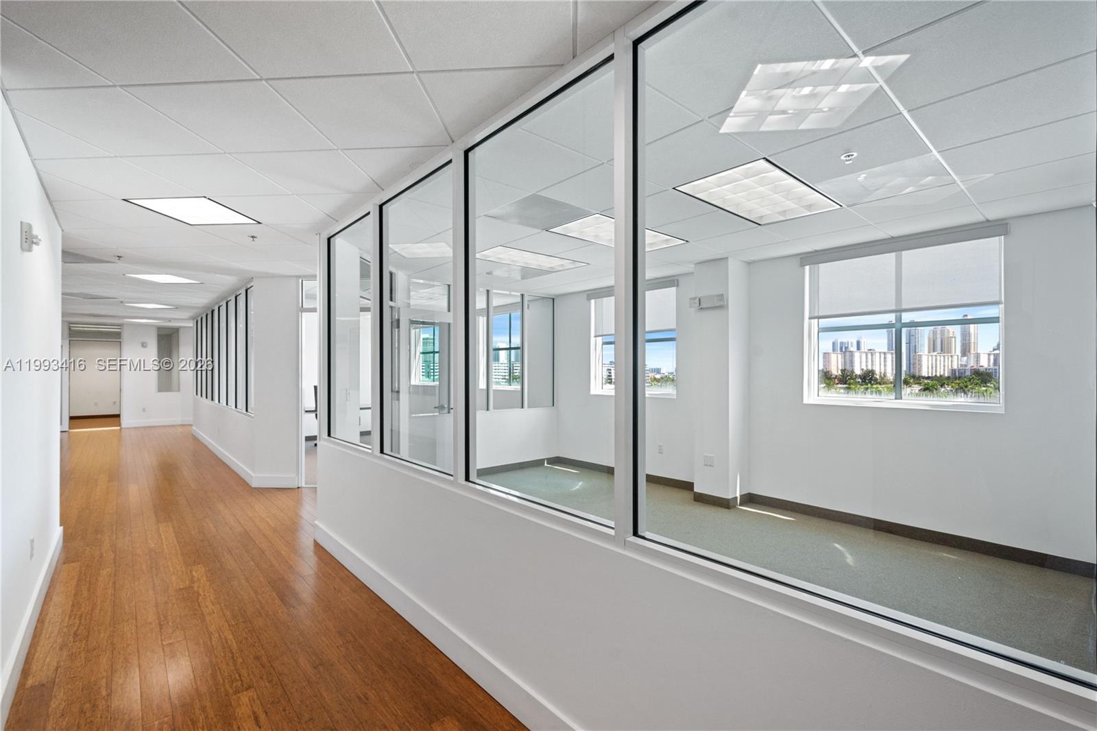 Exceptional opportunity to own a combined 2,996 sq. ft. of premium office space (three adjacent units) in the sought-after Office 163 Condo. Designed for functionality and comfort, the layout includes a dedicated conference room, a welcoming reception area, six oversized private offices, a storage room, and a full kitchen. The property also offers six assigned covered parking spaces—an invaluable asset in this high-demand corridor. Perfect for established firms, expanding businesses, or investors seeking strong commercial demand in North Miami Beach. Perfect location between Sunny Isles Beach and Aventura.