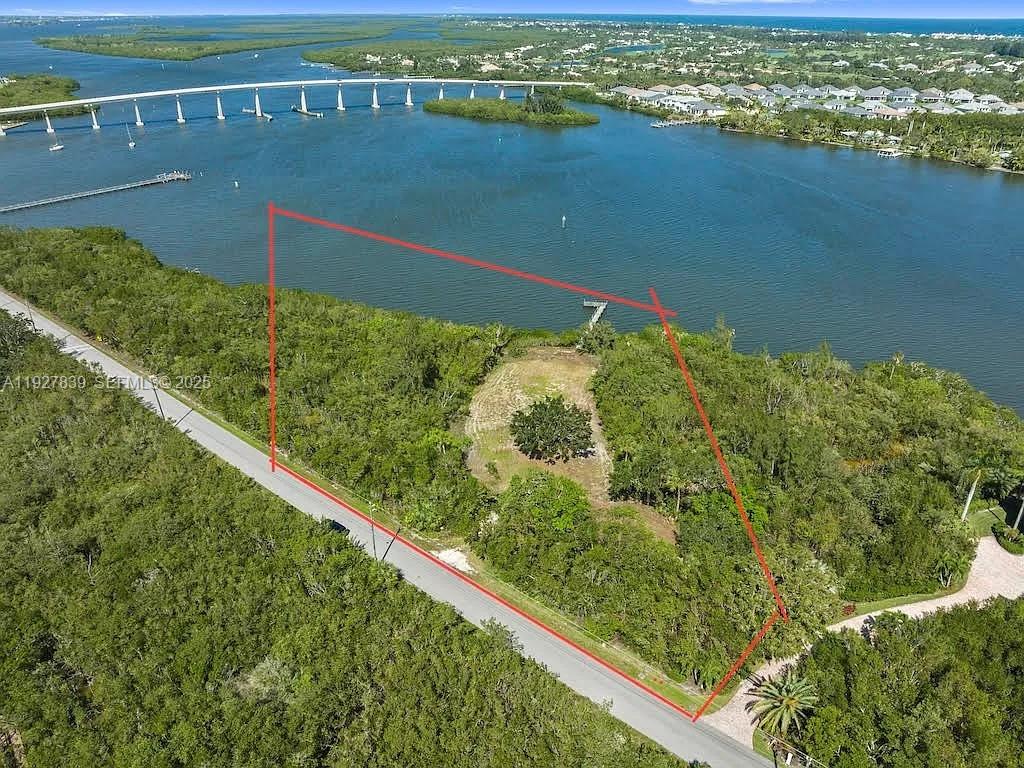 Paradise truly awaits on this rare 3.42-acre direct waterfront residential homesite along the breathtaking Indian River Lagoon, offering exceptional privacy with no HOA. Enjoy expansive, unobstructed views of the river and the iconic Wabasso CR510 Causeway right from your backyard. With the Intracoastal Waterway just steps from your 100’ private dock and only 8 miles to the Atlantic Ocean via Sebastian Inlet, this property is ideal for boating and water enthusiasts. The groundwork is already complete with a wetland survey, environmental studies, soil test, boundary survey, plot plan, and house plans available, presenting a remarkable opportunity to create your custom waterfront estate without restrictions.