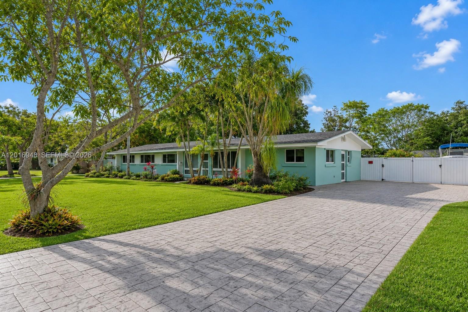 Welcome to 9340 SW 178 Street — a beautifully updated pool home that blends modern comfort with true South Florida living. Set on an impressive 16,560 sq ft lot, this residence stands out from the moment you arrive with clean curb appeal, mature landscaping and a private feel that is hard to find in today’s market. Step inside to an open floorplan filled with natural light, plantation shutters, impact windows and a large family room that creates the perfect setting for everyday living and effortless entertaining. The remodeled kitchen serves as the heart of the home with quartz countertops, solid wood cabinetry and stainless steel appliances, offering a clean, timeless design. The home features a newer roof, PVC PIPES, remodeled guest bath and a thoughtful layout that maximizes space and comfort. Outdoors, the oversized yard is where the property truly shines. The 16k lot provides room for a boat, RV, future additions and still leaves plenty of green space to enjoy. Fruit trees, a sparkling pool and covered areas make this the kind of backyard families dream about — private, peaceful and built for gatherings. Located in a quiet, established neighborhood near top schools, parks, restaurants, Black Point Marina and major roadways, This home offers the rare combination of space, upgrades and prime location. 4th bedroom is a den.