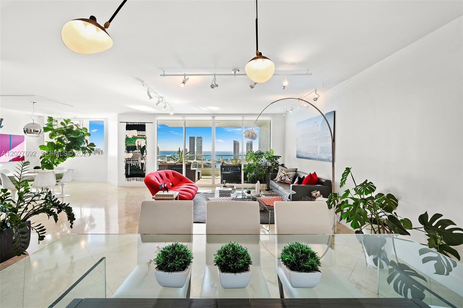 Experience elevated luxury in this magnificent Grand Suite Upper Penthouse at Peninsula I, offering 3,400 SF of sophisticated living space with 3 bedrooms, 3 full bathrooms, and 1 half bath. Showcasing breathtaking panoramic views of the Intracoastal Waterway and the Atlantic Ocean, this exceptional residence features an expansive open-concept layout designed for both elegant entertaining and everyday comfort.

Beautiful marble floors flow throughout the home, complemented by a sleek contemporary chef’s kitchen with premium finishes and top-of-the-line appliances. Floor-to-ceiling glass windows and doors flood the interiors with natural light while framing spectacular water views from nearly every room.

The crown jewel of this penthouse is the private rooftop terrace — an extraordinary retreat perfect for relaxing, entertaining, and enjoying sunrise-to-sunset vistas over the ocean and city skyline.

Residents of Peninsula I enjoy world-class resort-style amenities including a luxurious spa, state-of-the-art fitness center, swimming pools, tennis courts, valet, and 24-hour security. Ideally located in the heart of Aventura, just minutes from premier shopping, fine dining, championship golf courses, and the area’s renowned beaches. A rare opportunity to own one of Aventura’s most spectacular penthouse residences.