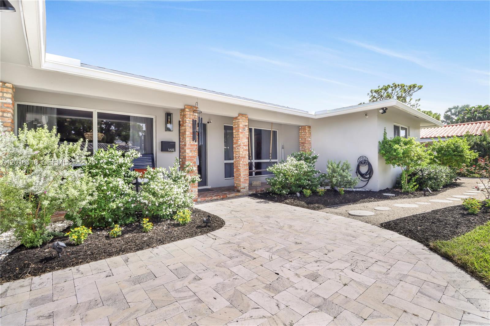 This Gorgeous 3 bed/3bath Approx 2300 sq. ft. Hidden Gem of a Home won't last! Many great details in this home. It is Nestled back off of 24th St. in Beautiful Wilton Manors. It is on a Private Road. Very peaceful and quiet. A Stunning, Large Master Suite Addition was added in 2024. It consists of a large bedroom huge master bath with a large shower, free standing tub, huge walk in closet and a covered patio.  Separate Laundry/Pantry Room and Den. Bedroom 2 has an en-suite.  Large Marble Driveway. This home sits on a lot larger than most in the neighborhood so there is room for a pool and lots of outdoor entertaining space! This home has been very well maintained and completely updated. All Impact windows and doors. Newer Appliances. Roof on the original house (2017) Main A/C (2019) Master addition has a new separate A/C and electrical panel. New main electrical panel added during construction.