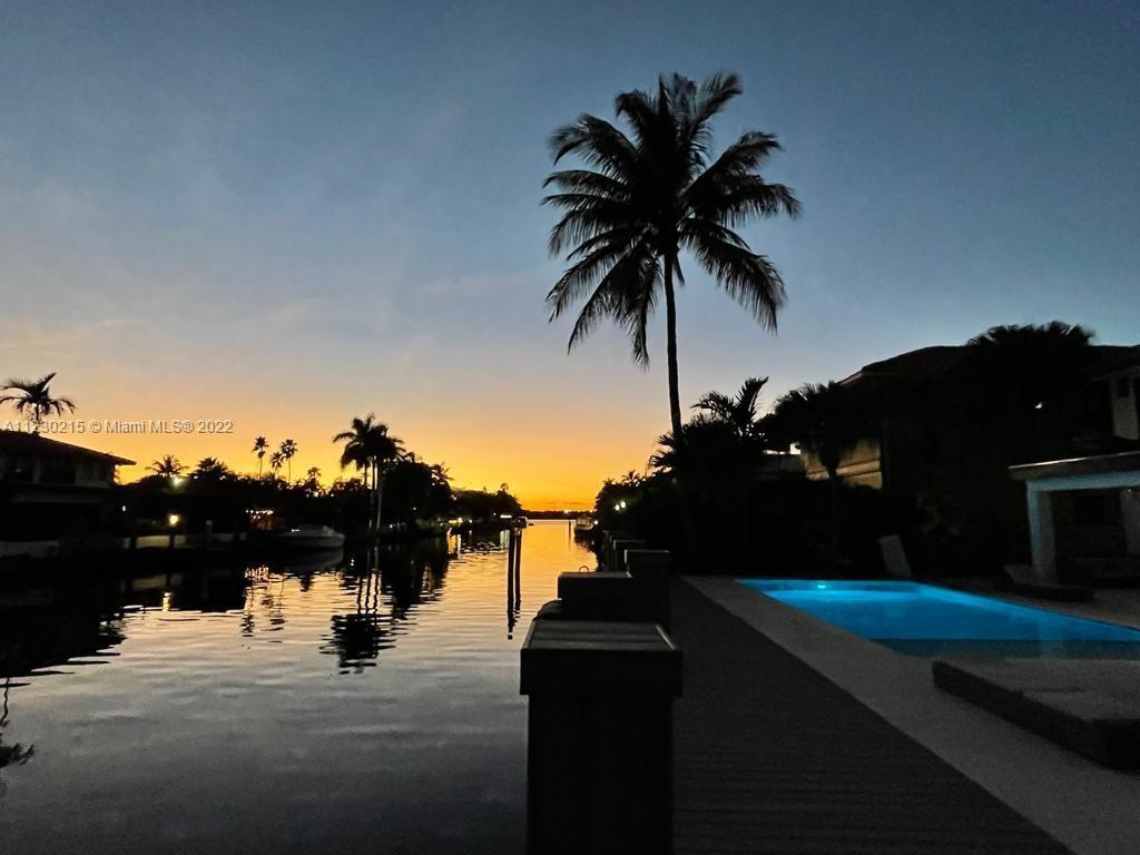 Brand New Construction Waterfront Home with 80 ft of dockage on oversized lot located at the private gated community of Eastern Shores. Boaters dream no fixed bridges & New Sea Wall. This luxurious masterpiece features many upgrades that were custom handcrafted, equipped w/ Sonos sound system,  Tesla fast-charging station, and automated AC, lighting, & curtains controlled from app. Endless amounts of natural lighting in the huge high ceiling living area w/custom fireplace,  stunning 16ft waterfall island Kitchen, and porcelanosa floors leading you upstairs to an oversized master suite offering bathtub and double shower & sinks, with private balcony to enjoy great sunset water views. Just minutes away from Sunny Isles Beach, Bal Harbour, Aventura Mall, and more shopping & dining.