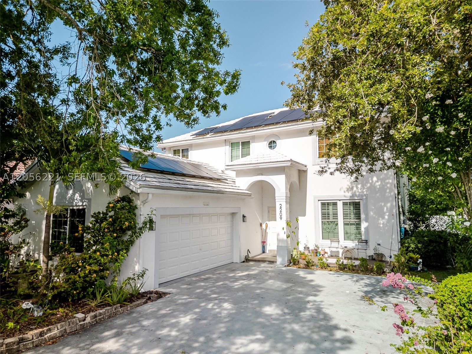 Welcome home to this beautifully updated 4-bedroom, 2.5-bath two-story residence tucked inside a secure, gated community with surprisingly low HOA fees. From the moment you arrive, you'll feel the pride of ownership and thoughtful modern touches throughout. Step inside to an open, light-filled layout perfect for both everyday living and entertaining. The home has been tastefully upgraded with contemporary finishes, offering a fresh, move-in-ready feel from top to bottom. Downstairs, the living and dining areas flow effortlessly into the kitchen, while a convenient half bath serves your guests. Find four generous bedrooms including a spacious primary suite and two full baths, delivering comfort and privacy for the whole family. The roof is less than 5 years old, and the fully installed, working, and completely paid-for solar panels, a rare and valuable combination with no hidden financing to assume. Hurricane Impact WINDOWS! The gated community offers security and peace of mind, all with low HOA dues that keep your monthly costs in check. Location couldn't be better. You're just minutes from downtown Boca Raton, with easy access to world-class shopping, dining, top-rated schools, parks, and the beaches that make this coastline famous. Commuting is a breeze with nearby highways. Don't miss this rare opportunity to own a modern, energy-efficient home in one of Coconut Creek's most desirable gated communities. Schedule your private showing today — homes like this don't last long!