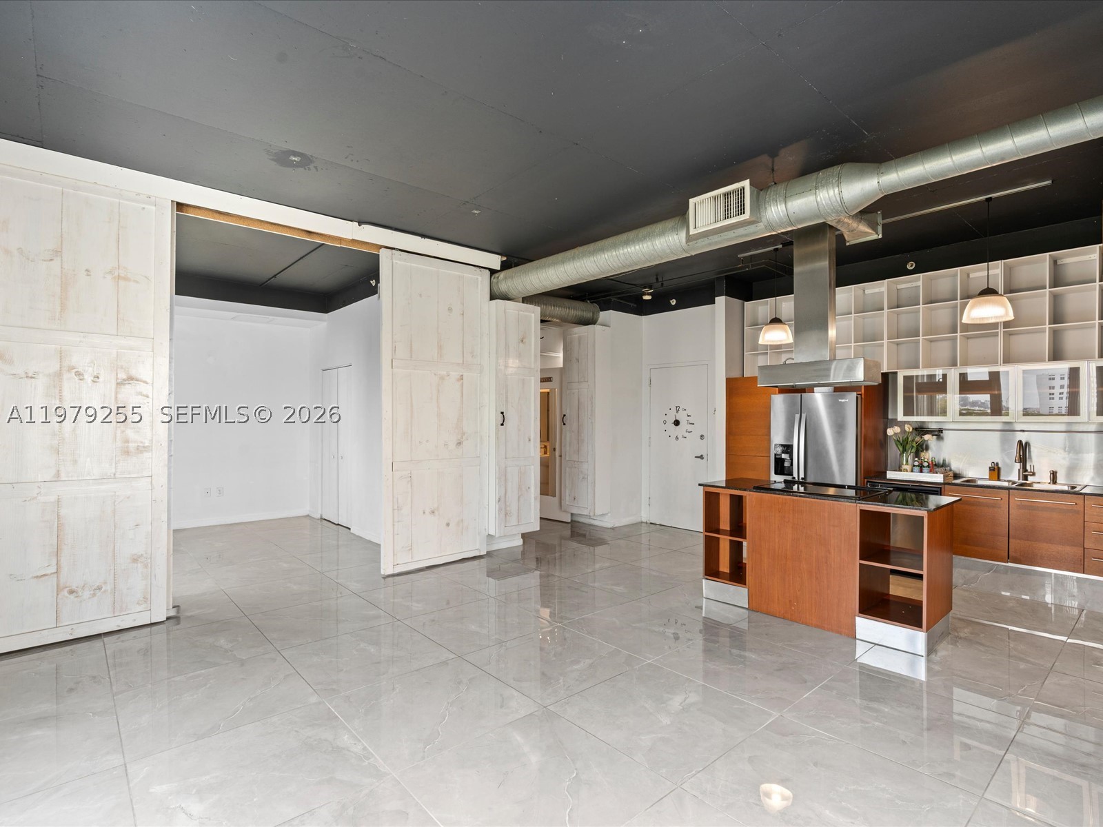 Discover urban living at Neo Lofts, ideally positioned in Miami’s historic Riverside district just steps from the scenic park along the Miami River. This bright and spacious 2-bedroom, 1-bath residence offers 925 square feet of thoughtfully designed living space and includes the rare convenience of two assigned parking spaces. Expansive windows fill the home with natural light, creating an inviting atmosphere that feels both open and comfortable. Directly across the street, the riverfront park provides a beautiful setting for morning walks, and relaxing outdoor moments along one of Miami’s most charming waterways. The surrounding neighborhood is known for its vibrant dining scene, with popular seafood restaurants, waterfront cafés, and local favorites lining the Miami River—perfect for casual lunches, sunset cocktails, or evenings out with friends. Residents also enjoy the convenience of an established Spanish restaurant located right in the building’s lobby level. Neo Lofts offers a collection of resort-style amenities including a newly renovated pool, spa facilities with sauna & steam room, a fully equipped fitness center, meditation garden, tennis courts & a dedicated dog park. Centrally located near the heart of Miami, the property offers convenient access to the dining, shopping, and nightlife of Brickell, Coconut Grove, Coral Gables, and beaches of Key Biscayne. This residence presents a wonderful opportunity to enjoy comfort, convenience, and the best of Miami living.