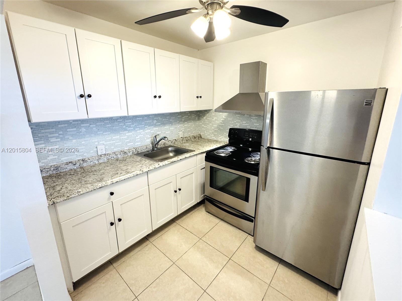 Experience the perfect blend of comfort and style in this beautiful first-floor condo. Bathed in abundant natural light, this unit features sleek tile flooring throughout and a modern kitchen equipped with updated appliances. Step inside to find a peaceful retreat with a serene view that invites relaxation. Located in a vibrant, active 55+ community, this home is ideal for those seeking a turnkey residence in a social and well-maintained environment.