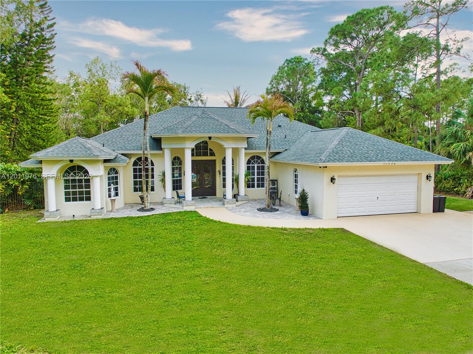 Situated in a beautiful equestrian community, this CBS BLOCK 3BR 2BA Home has a spacious Den or 4th Bedroom, 2 Car Garage, and Pool in Jupiter Farms on a large 1.25 Acre Lot. This newer home was built in 2000, and is 2,574 Sq Ft under air with 11’ ceilings. New Roof in February 2026 with a transferable warranty and wind mitigation report! New Air Conditioning units. New Water Filtration system with a phone app. New Well Pump. New Rheem Tankless Water Heater 2024. New Master Bath Electric Blinds. New Mastercraft Twilight 240 Hot Tub. New Aleko Front Gate and actuator 2026. Septic tank was cleaned out and new filter 2025. Spacious Kitchen, with all new appliances. Elegant Master Bedroom and Master Bath. New carpet with Tempur-Pedic padding in the bedrooms, and Berber carpeting in the Den. Fiberglass wall insulation. Spacious 2 Car Garage with side door and epoxy floors. Lush tropical landscaping with a Sparkling 35’ x 20’ Diamond Brite Pool (3’–5’–3’) with a removable volleyball net and a 2,000 plus square foot pool deck. Mastercraft Twilight 240 dual pump Hot Tub in 2022. Beautifully lighted Waterfall Fountain. Large covered patio 12’ x 32’. NO HOA bring your Horses, Boats, RVs, Jet Skis, and Trailers. Large 12’ x 12’ storage shed. Excellent location close to Beautiful Beaches, I-95, Florida Turnpike, Gardens Mall, and West Palm Beach Airport. Excellent A-Rated schools. Paradise Awaits!