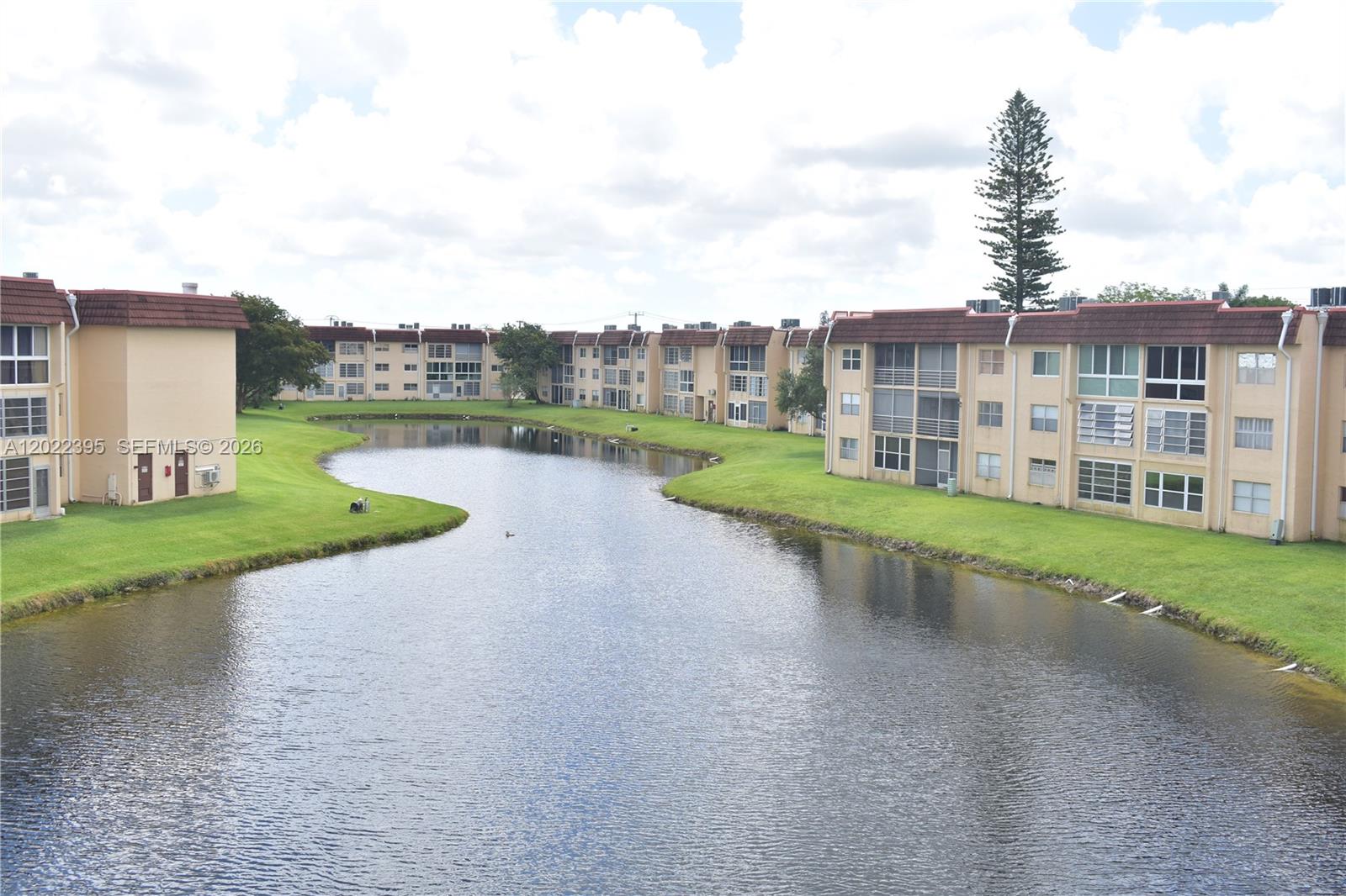 This is a very nice 1 bedroom unit overlooking a long water view.  Inside, the floors are ceramic tile laid diagonally, plus an updated bathroom and updated kitchen with white cabinets and stainless steel appliances.
One bedroom units do not usually include a dishwasher, but this one does!  Other good items of note:  NO popcorn ceilings, indirect lighting in the kitchen, crown molding at the ceiling to dress up the condo and newer appliances including A/C (2018) and Water heater!  If you are looking for a 1 bedroom unit which is very fairly priced and in good condition, please make sure to visit!  Your maintenance includes a service contract with Pride so less headaches if anything breaks.  Phase 3 in Sunrise lakes has many amenities including a golf course, 10 swimming pools (some salt water rather than chlorine)and one of them is right by this building, tennis and pickleball courts, a gym, billiard room and plenty of activities daily including bingo on monday evenings and movies on tuesdays.  If you are ready to enjoy life, here's where it is happening!  EZ to show!  Matterport virtual tour coming soon!