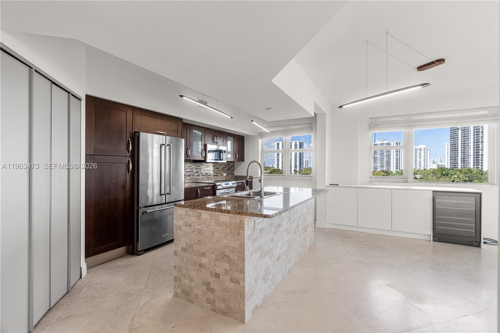 *** REDUCED *** Spacious 3BR/3BA CORNER unit in Turnberry Village, Aventura offering over 1,600 SF with stunning golf course and water views. Ideally located on Promenade Circle with unmatched walkability to shops, dining, and entertainment. Features include custom built-in closets, built-in wine cooler, and automatic custom blinds. Bright, open layout with abundant natural light. A rare opportunity to enjoy luxury and convenience in a premier community.