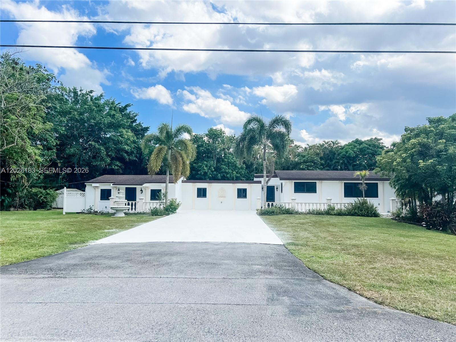 Beautifully nestled in the prestigious community of Plantation Acres in Plantation, this stunning multigenerational estate offers 3 bedrooms and 3 bathrooms in the main residence plus a private income-producing 2BD/2BA apartment with separate electric meter, ideal for guests, in-laws, rental income, or extended family living. Enjoy a serene private pond with deck and seating area, an open-concept layout filled with natural light, and seamless indoor-outdoor living leading to a beautiful wooden deck and sparkling pool surrounded by privacy and lush outdoor space perfect for entertaining. Located in an equestrian-friendly community just minutes from premier dining, shopping, major highways, and top conveniences, this unique property blends tranquility, flexibility, and lifestyle in one exceptional opportunity.