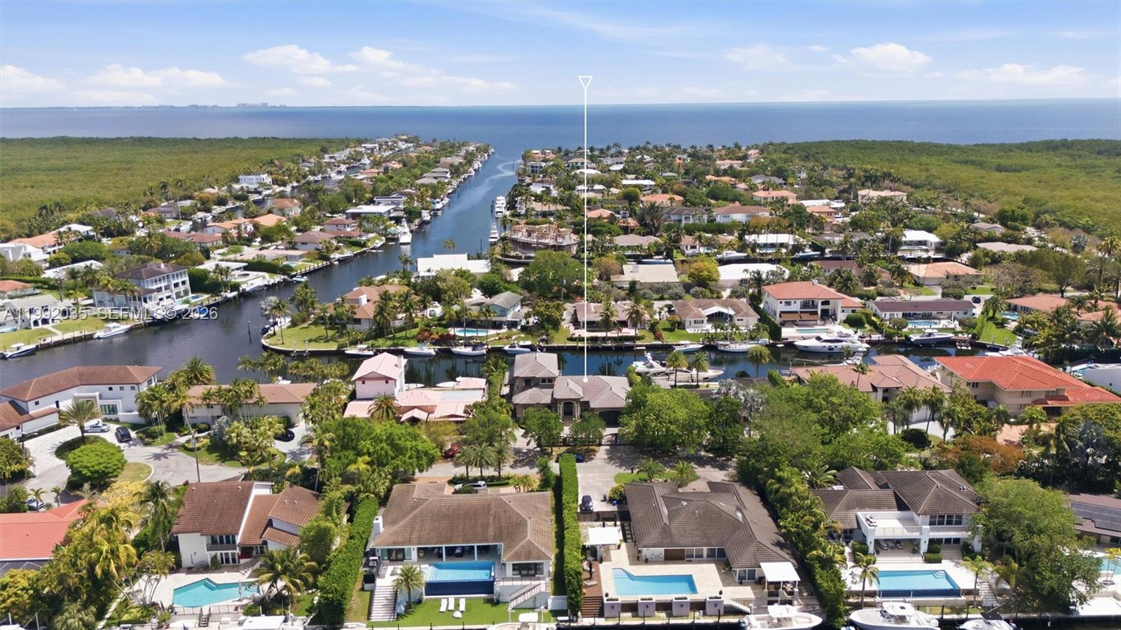 GORGEOUS GATED WATERFRONT ESTATE in Gables By The Sea. This stunning 2 story 4 Bed / 4.5 Bath home offers the ultimate luxury lifestyle with no bridges to the bay a true boater’s paradise. Featuring a 100’ reconstructed seawall, 9’ draft and direct ocean access, this property is built for waterfront living.
Step inside to soaring 12’ ceilings and a breathtaking 14’ ceiling in the grand room, elegant 24” marble floors, a grand staircase, and exquisite Brazilian wood doors. Enjoy impact windows and expansive 10’ sliding glass doors that flood the home with natural light.
The gourmet kitchen features premium appliances, granite counters and custom cabinetry, perfect for entertaining. Elevate your lifestyle with a private club room featuring a full bar, private bathroom and VIP entertainment space overlooking the pool and dock, a true showpiece.
Step outside to your private oasis with a saltwater system pool, summer kitchen and expansive deck. The luxurious primary suite offers a sitting area, spa style bath, walk in closets, private office and terrace.
Additional highlights include pool bath, media room, 4 A/C zones, 2 central vacuums, 2 car A/C garage and full exterior lighting & camera system. Owner built with no expense spared crafted for comfort, quality and lifestyle.