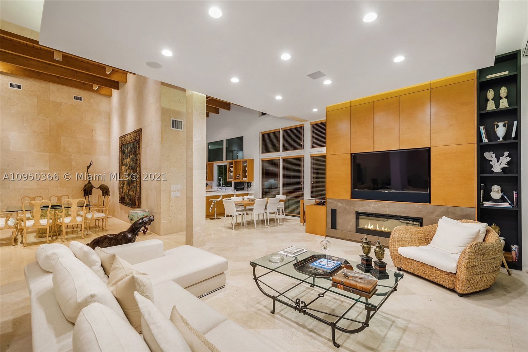 This contemporary bi-Level waterfront home sits on a 25,804 SF lot in guarded Sunset Island I. The 6BR/6+2BA split floor plan home features marble floors, amazing architectural design, custom walls & built-ins, soaring wood-beamed ceilings, skylights & large windows to enjoy true indoor/outdoor living. Amazing extended living room w/custom bar, open dining & family room w/fireplace all w/views to the pool & bay. Gym, office & temp/controlled wine room. Gourmet eat-in kitchen w/top-of-the-line Thermador & Sub-Zero appliances, butler’s pantry & separate breakfast area. The sumptuous principal suite features a seating area, voluminous dual walk-in closets & Carrara marble bathroom w/dual walk-in showers & spa tub. Large pool w/fountain, covered seating area, 97’WF, direct Bay & Ocean access.