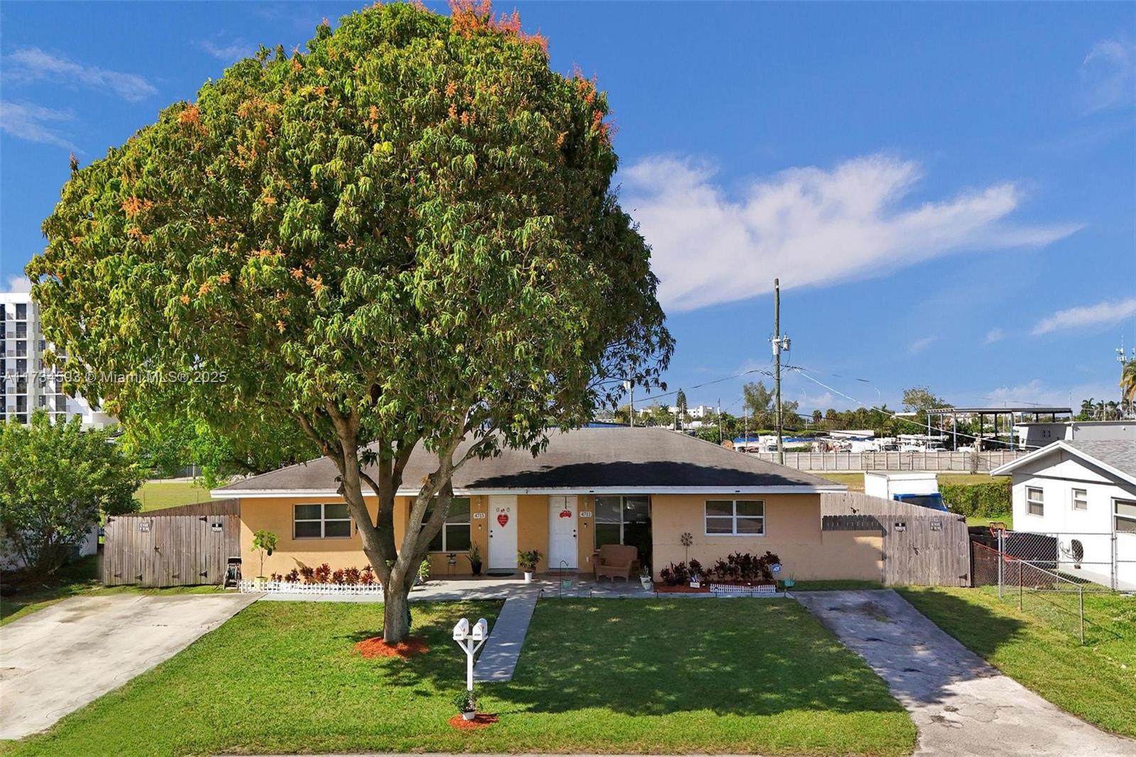 This well-maintained duplex features reliable long-term tenants and offers excellent investment potential. Unit 4715 boasts 2 bedrooms, 2 bathrooms, and a den/office space, while Unit 4711 offers 2 bedrooms and 1 bathroom. Both units include separate laundry rooms for added convenience. The kitchens and bathrooms have been upgraded for a modern touch. Outside, a large, fenced-in backyard is divided, providing each tenant with their own private outdoor space and patio area. The front yard has a beautiful mature mango tree that provides shade during the summer while adding charm to the property. Conveniently located near the Hard Rock Hotel and Casino, as well as upcoming apartment developments along 441 and Griffin Rd, this property is in a prime area for growth and investment.
