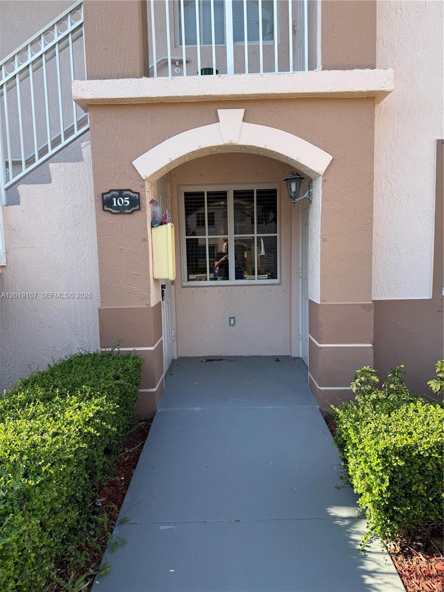 First-floor 2 bedroom, 2 bathroom condo in gated Venetia Gardens with peaceful lake and green-area views. This 822 sq ft unit offers an open living/dining area, light-toned flooring in the main living space, tile flooring in the kitchen and bedrooms, two full bathrooms, and convenient ground-floor access. The kitchen features white cabinetry, refrigerator, range, microwave, dishwasher, and a pass-through opening to the living area. One bathroom has been updated with a walk-in shower and newer vanity finishes. Enjoy a quiet rear patio setting overlooking the lake and landscaped common areas. Excellent opportunity for an owner-occupant or investor looking for value in Homestead.