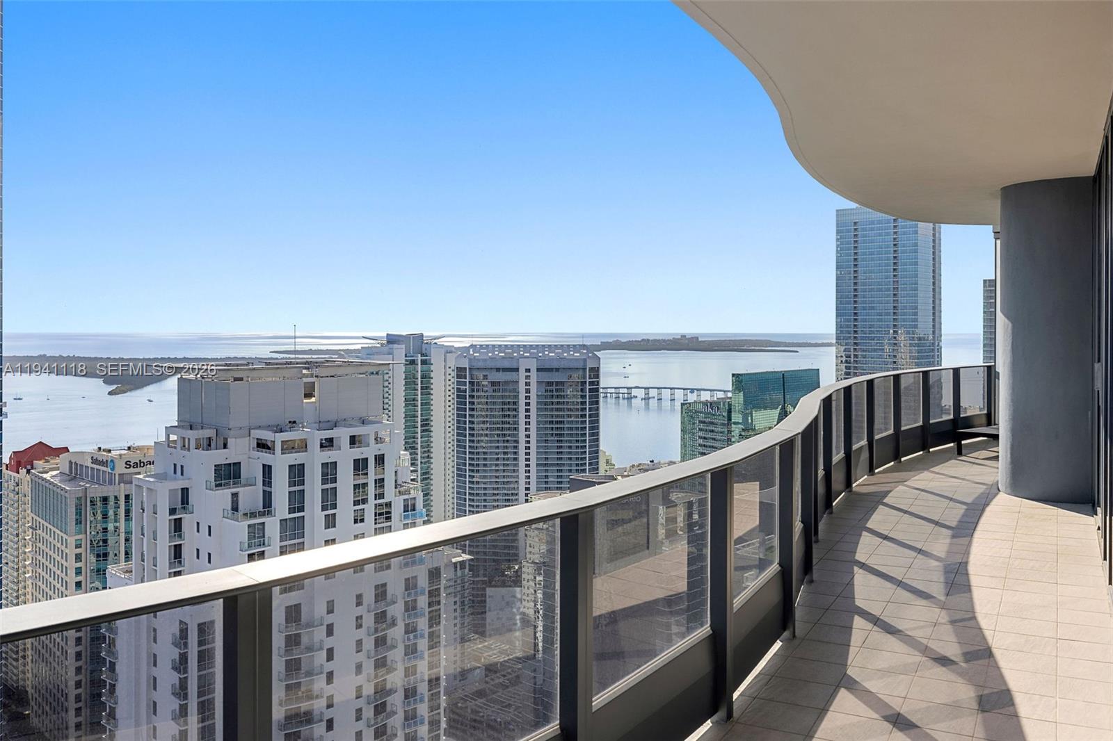 Enjoy luxury living in this spacious 2 bed + den / 3.5 bath penthouse on the 54th floor of Brickell Flatiron. This penthouse offers privacy & sweeping views of the Miami Skyline, Biscayne Bay and the Atlantic Ocean. Initially designed as a 3 bedroom residence, this can be easily converted to the original 3 bedroom layout. Features: 10-foot high floor-to-ceiling glass windows, travertine flooring, Snaidero kitchen cabinets, Miele appliances, electric shades, two entries and a full length balcony accessible from each room. The 64th floor rooftop amenities include a resort style pool area, oversized fitness center with pilates/yoga room and a private spa/relaxation area. Add'l amenities include a club room, a lap pool, movie theater, children's playroom, lounge & billiards room. 24 hour valet, concierge, doorman and security. Located next to Mary Brickell Village & Brickell City Center. Three parking spaces included.