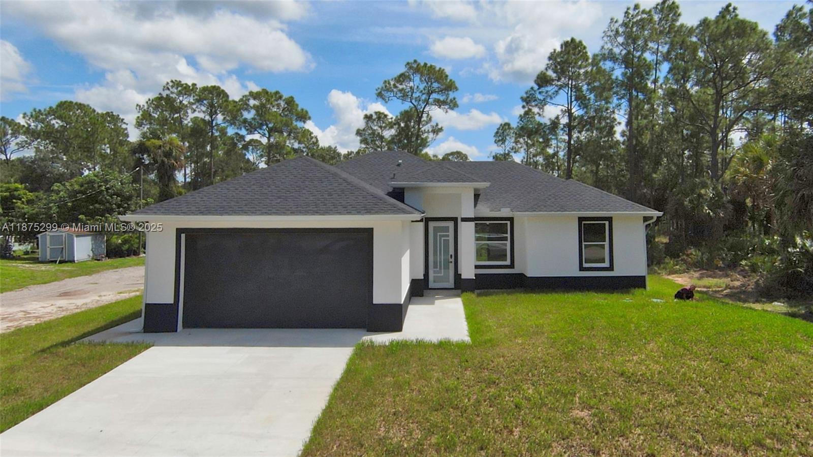 This home features:  an open floor plan with high-quality wood cabinets, elegant quartz countertops, stainless stain appliances and impact-resistant windows/doors. The oversized lot provides plenty of room for a pool, a barbecue area with a pergola , a garden, parking a motor home or additional storage etc.