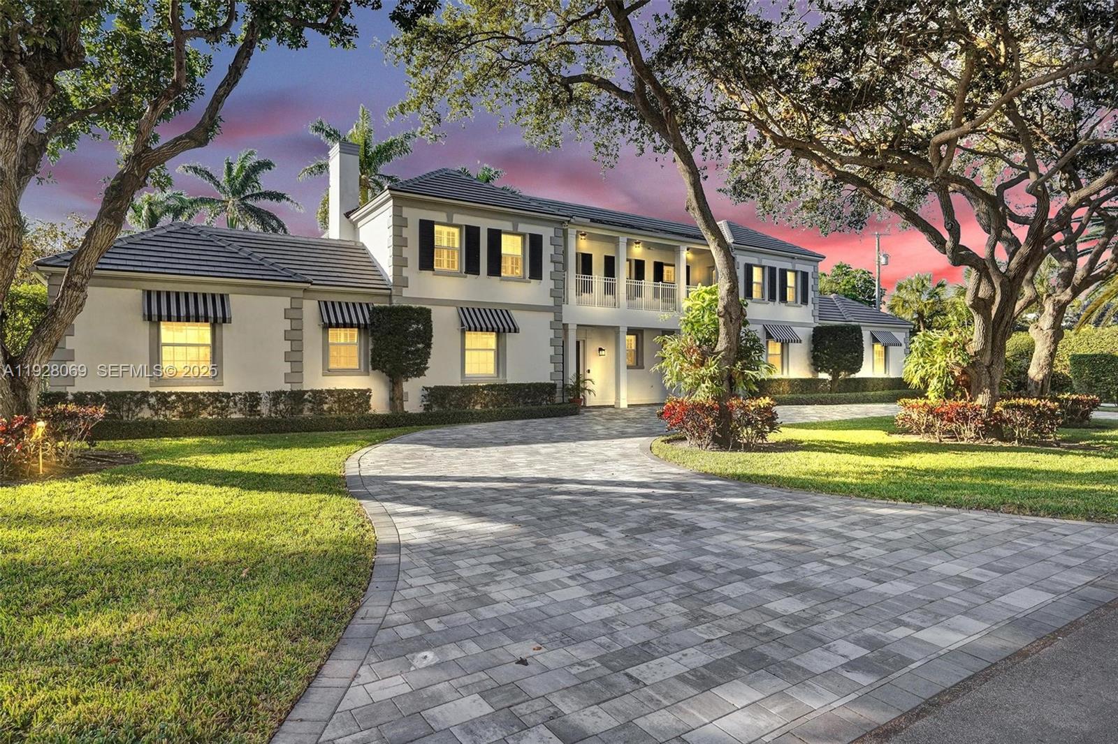 An iconic Fatio-designed estate, masterfully restored and ideally positioned just one block from the ocean. Set on an expansive 200' × 160' corner lot, this sophisticated 7BR/8.5BA residence — including a private guest house — offers 5,652 sq ft of timeless elegance. The home showcases impact-glass windows, rich wood floors, a designer-updated gourmet kitchen, beautifully renovated baths, architectural detailing, and multiple fireplaces. Outdoor living shines with a resort-style pool, lush landscaping, expansive green spaces, and a covered loggia with a full summer kitchen, perfect for year-round entertaining. Completed by a circular drive, 2-car garage, full concrete/impact construction and a new roof from 2025, this exceptional property blends historical charm with modern luxury in one of Boca Raton’s most desirable seaside enclaves.