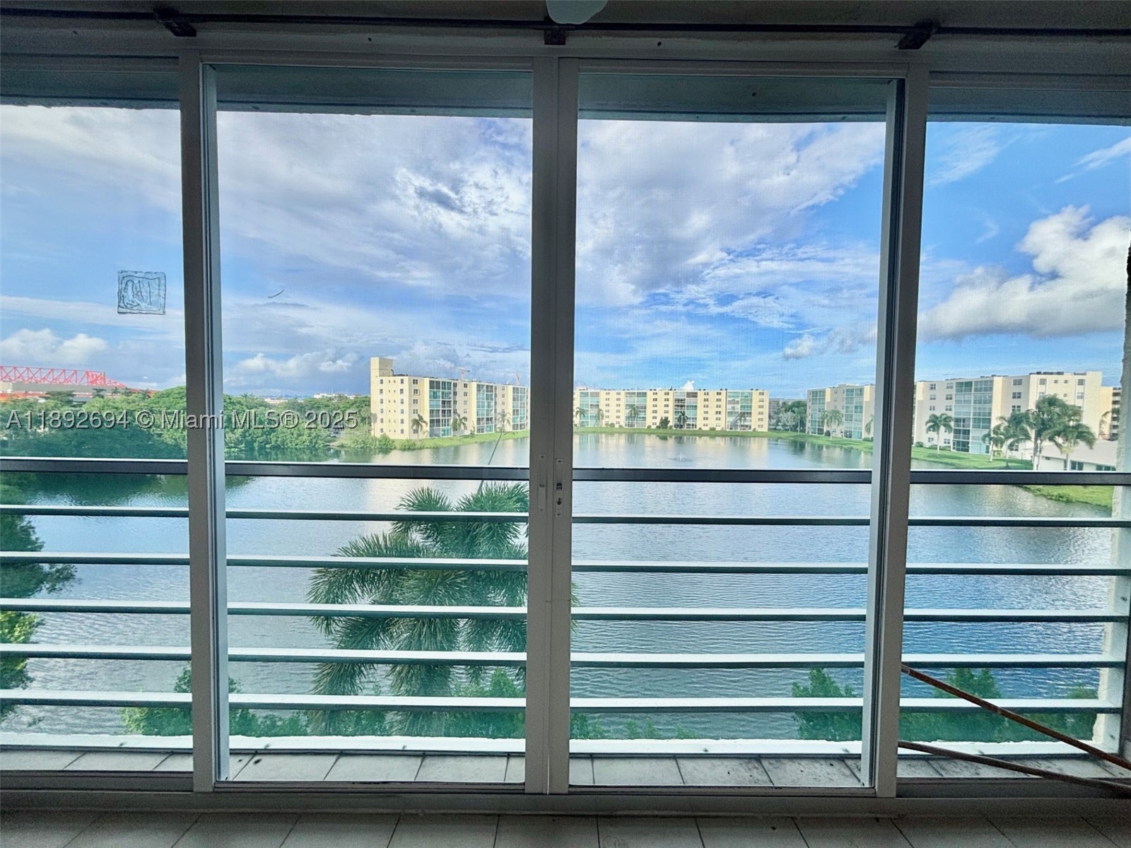 Step inside & be instantly wowed — the lake views hit you in the face the moment you walk through the door! This large & bright 2/2 condo offers a fantastic layout w/ plenty of natural light & endless potential. It needs TLC, but the price reflects that & gives you the perfect opportunity to make it your own. Enjoy morning coffee or evening sunsets overlooking the peaceful lake from your private space. Low HOA fees in this 55+ community keeps ownership affordable. Just minutes from the beach, shops, dining & only 15 minutes from Fort Lauderdale Airport — the location can’t be beat.  Whether you’re looking for a forever home, a winter getaway, or an investment opportunity, this condo checks all the boxes!