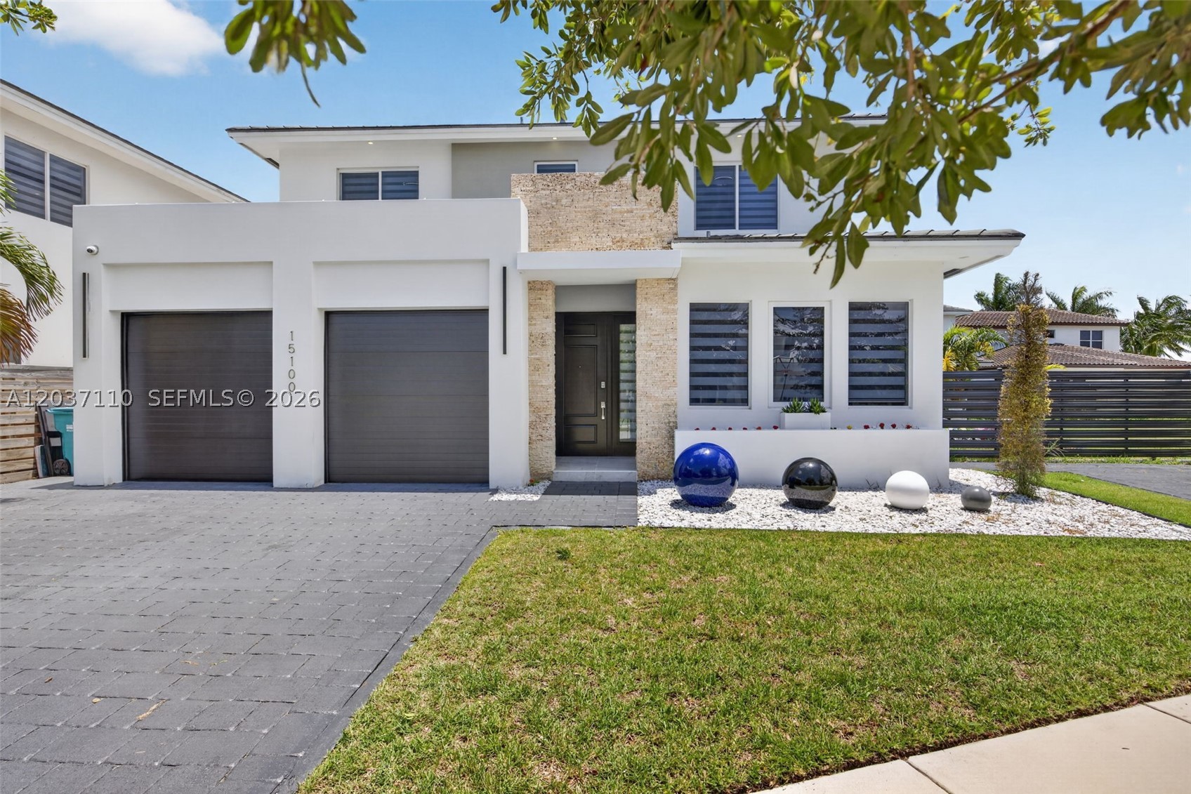 Discover this stunning Luxcom built home situated on the largest lot in Venetian Parc. Offering 6 bedrooms, 4 bathrooms, and 3,698 total SF, this exceptional residence features a desirable first-floor primary suite, soaring 10-foot ceilings, impact windows and doors, marble flooring downstairs, and wood-look tile upstairs. Thoughtfully upgraded with smart home technology, built-in surround sound, an electric fireplace, intelligent lighting, and security cameras. The expansive backyard is designed for entertaining, complete with a custom pergola featuring electricity, lighting, fans, stadium lighting, and a brand-new fence. A rare opportunity to own one of the most upgraded homes in the community.