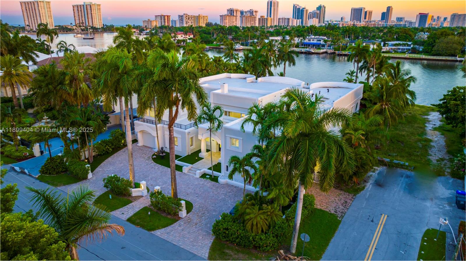 Experience one of the most extraordinary waterfront estates in all of Hollywood Lakes. Positioned on over half an acre along prestigious North Southlake, this rare point of land offers unmatched privacy, massive grounds, and breathtaking wide-water Intracoastal views from nearly every room in the home.

Spanning over 7,000 sq ft, this 8-bedroom, 6.5-bath residence is designed for both grand entertaining and elevated everyday living. From the moment you enter, soaring ceilings, expansive glass, and marble floors frame endless water vistas that feel truly world-class.

The outdoor space is what sets this property apart—a sprawling backyard rarely found on the Intracoastal, complete with resort-style pool, spa cabana, and multiple covered terraces, all surrounded by lush privacy and open sky. Whether hosting large gatherings or enjoying quiet sunsets, the setting is simply unmatched.

For boating enthusiasts, enjoy direct ocean access with no fixed bridges, a 100-foot seawall, and a 50-foot private dock—perfect for large vessels and effortless days on the water.

Additional highlights include a gourmet chef’s kitchen, custom bar, expansive living areas, and multiple balconies capturing sunrise-to-sunset views.

This is more than a home—it’s a private waterfront compound, offering scale, views, and land that are nearly impossible to replicate in South Florida.