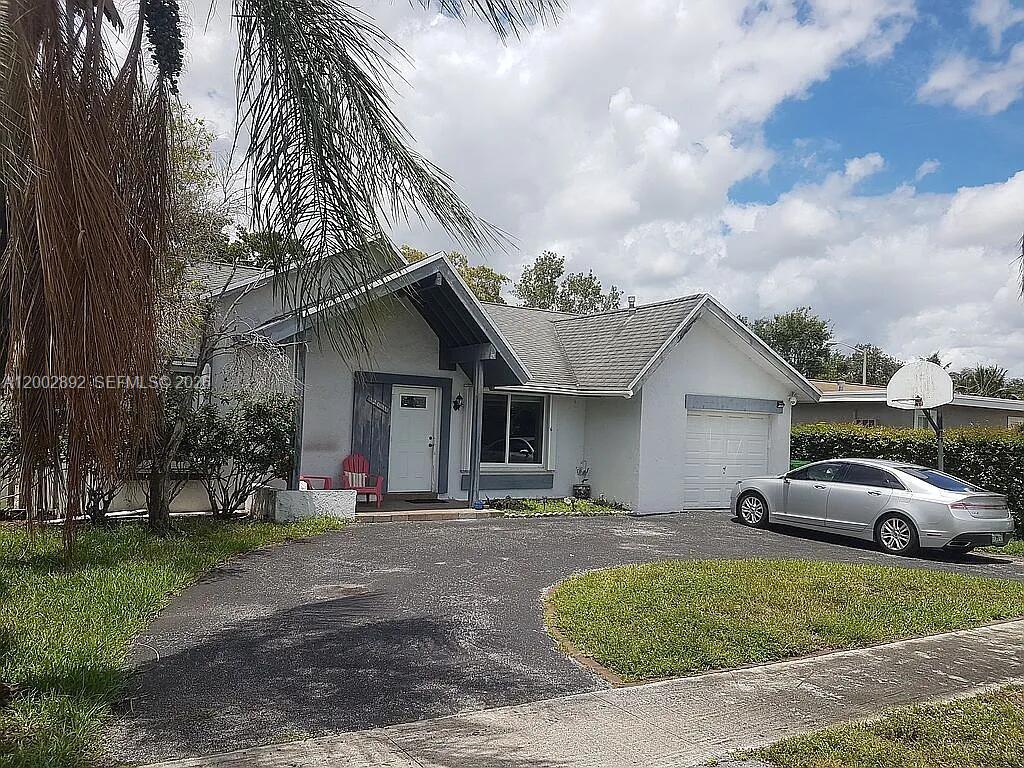 This clean, move-in ready, 3/2 plus mother in law suit with kitchenette refrigerator, washer and dryer connections off the pool with own entrance. House has living room, family-room and dining room. Home features updated, modern tile throughout, vaulted ceiling, updated eat-in kitchen with electric stove can be changed to gas, ceiling fans, and closet space throughout,bathrooms with accessible/roll-in shower in master bath and updated new Bathroom 2024. Hurricane shutters and impact windows. Motivated seller