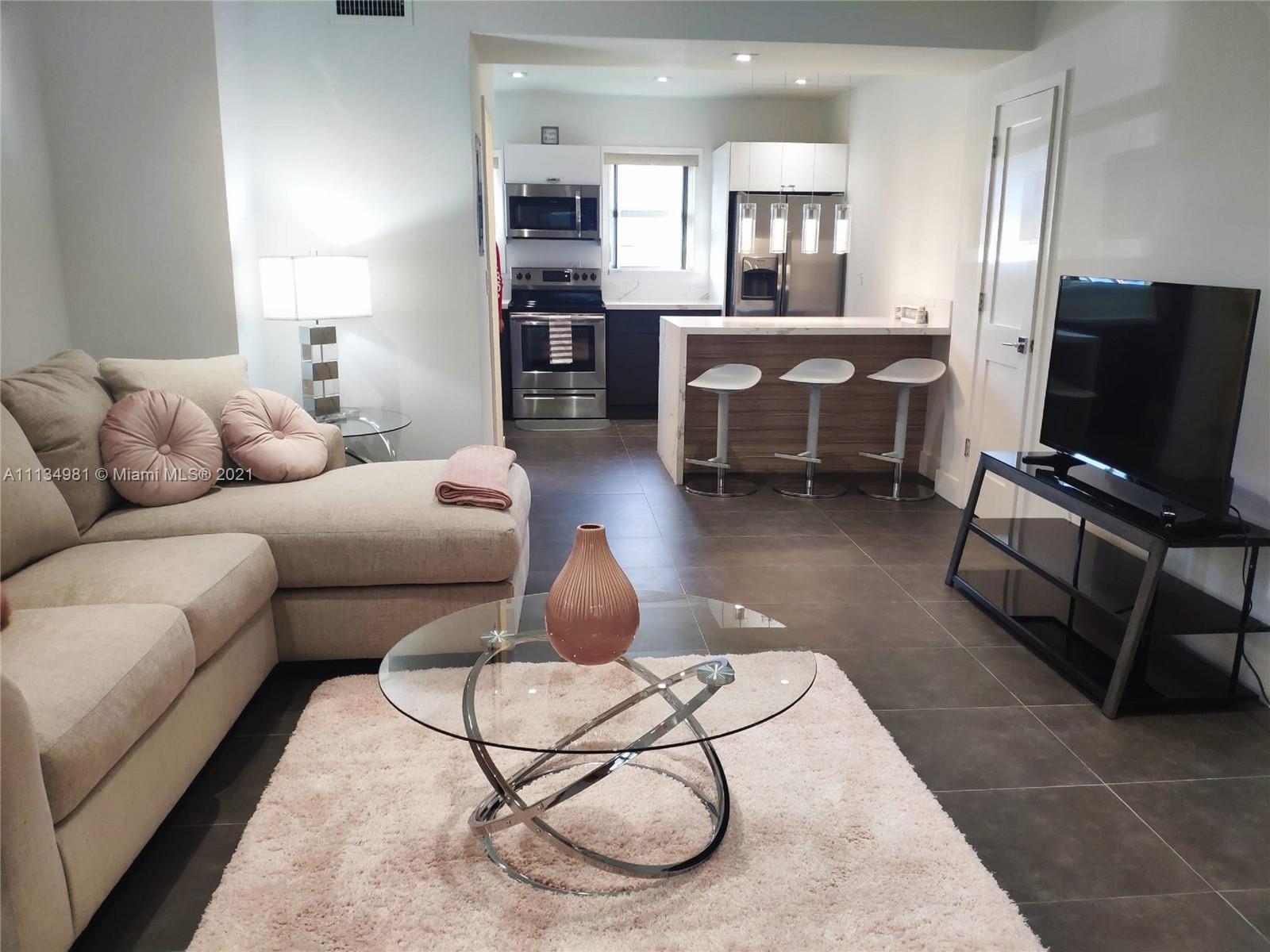 Welcome to this Modern turn key apartment located in the heart of south beach right next to the world famous Lincoln road. This stunning apartment has an ultra modern design, as soon as you walk in you're greeted with grey tiles floors, all white walls giving it a modern feel. Then as you continue forward you're greeted with a beautiful modern kitchen with white counter tops and and a wood finished island, stainless steel appliances! As you move on upstairs you're meet with a super spacious bedroom with two custom closets, an amazing bathroom with a custom rainfall shower, and a work space area and a washer and dryer area. This apartment is about 6 blocks from the beach by walking down Lincoln road, you can also find the best shopping and dining areas nearby!