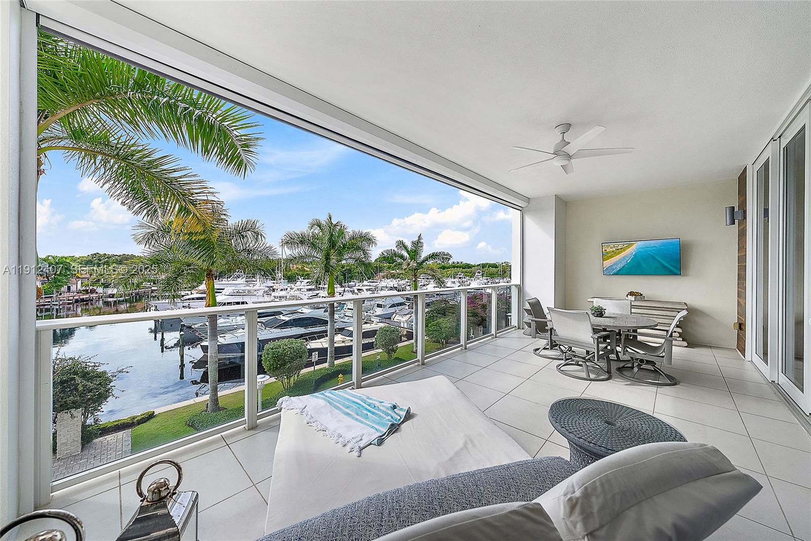 Move in for season. This financially sound premier boutique building offers exceptional concierge services, only blocks from the Intracoastal & beautiful blue-water beaches. Step from your privately keyed elevator into a bright, open floor residence enhanced with designer built-ins throughout, Thermador appliances, upgraded fixtures, & custom closets. Azure combines luxury living with a hurricane-safe marina, making it one of northern Palm Beach County's hidden gems—just minutes from Palm Beach & Jupiter Island. Residents enjoy a 24/7 manned gate, fitness center, heated pool/spa, sauna, locker rooms, climate-controlled wine room, business center, club/card room, catering prep kitchen, putting green, golf simulator, climate-controlled storage & two indoor assigned garage spaces.