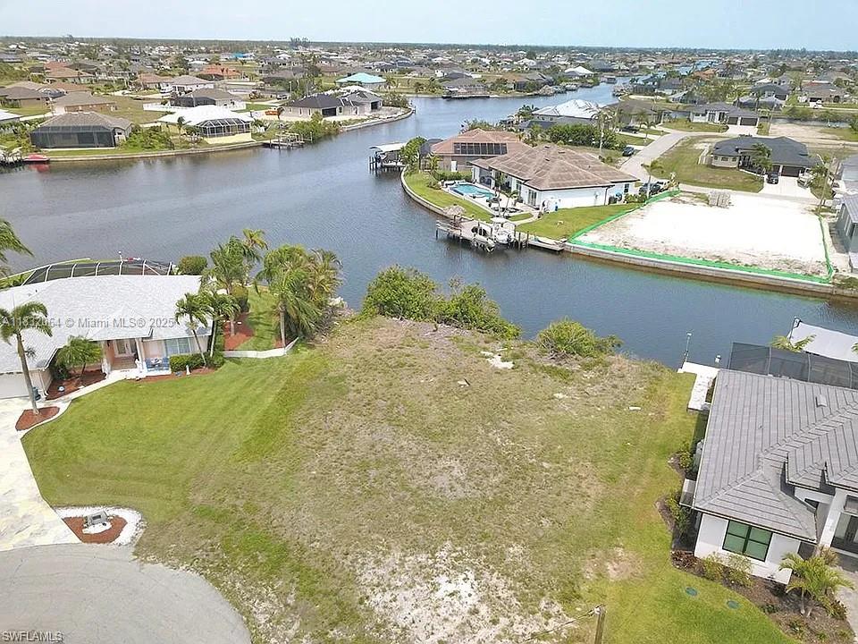 This beautiful Northwest GULF  ACCESS lot is perfect for your new dream home and to keep your boat right behind  your home.  The irregular-shaped lot is located on a quiet cul-de-sac with aprox 112 feet of waterfront.  You will have an amazing view overlooking intersecting canals.  Northwest Cape Coral is the upcoming area with brand new homes being built everywhere.  Enjoy fishing right from your property. New seawall.