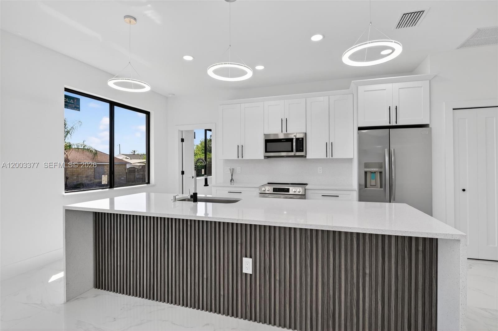 Brand-new home with elegant modern finishes, high ceilings, and abundant natural light, highlighted by large windows and 8-foot doors that create a spacious, bright, and sophisticated atmosphere throughout. This thoughtfully designed residence offers 3 bedrooms, 2 full bathrooms, and a versatile den ideal for a home office, media room, or additional living space, along with a two-car garage with an electric door.

The property is delivered fully equipped exactly as shown, including all appliances, washer, and dryer, providing a true move-in-ready experience from day one with no additional investment needed. Located in a strategic, convenient, and fast-growing area, this home represents an excellent opportunity for both living and investment, combining modern design, functionality, and strong long-term appreciation potential.
