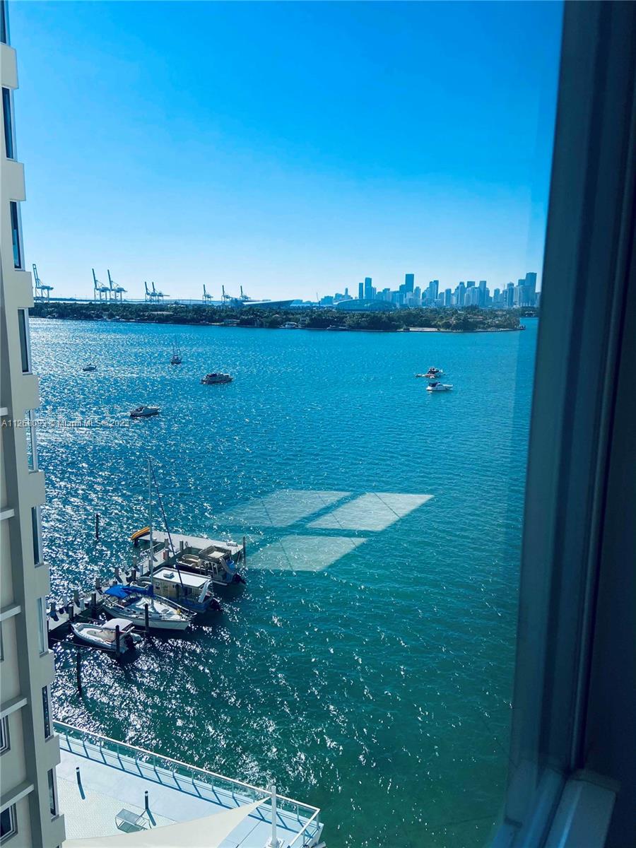 INVESTOR ONLY - rented at $3,100 per month. Beautiful view and tons of light from this huge 1 bedroom + den, 1/5 bath unit in the heart of Miami Beach. Just 2 blocks from Whole Foods, 8 to the Beach, and 6 to Lincoln rd. The Condominium underwent a complete renovation in the last few years. 24 Hour Doorman, gym right on the pool deck where you'll find the heated swimming pool. Dock available on waiting list. Bike/Paddle-board storage, individual storage/luggage locker, assigned covered garage parking. This unit can easily be converted into a full 2 bedroom 2 bath; similar "15" line units have been recently.